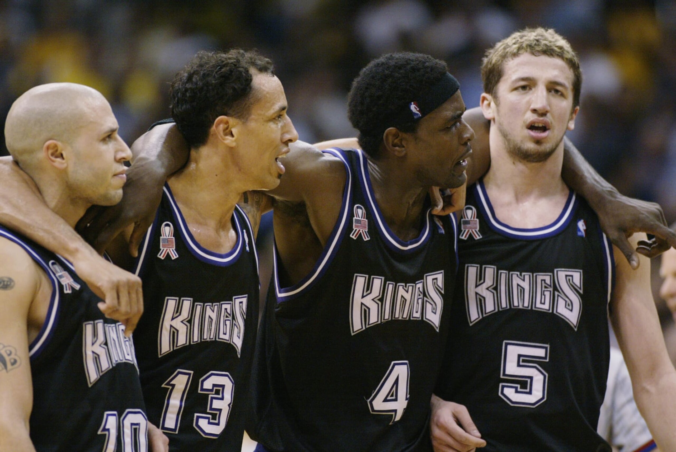 LOS ANGELES - MAY 24:  (L-R) Mike Bibby #10, Doug Christie #13, Chris Webber #4 and Hidayet Turkoglu #5 of the Sacramento Kings stand together in Game three of the Western Conference Finals during the 2002 NBA Playoffs against the Los Angeles Lakers at Staples Center in Los Angeles, California on May 24, 2002. The Kings won 103-90.  NOTE TO USER: User expressly acknowledges and agrees that, by downloading and/or using this Photograph, User is consenting to the terms and conditions of the Getty Images License Agreement.   Mandatory Copyright Notice: Copyright 2002 NBAE  (Photo by Jed Jacobsohn/Getty Images) 