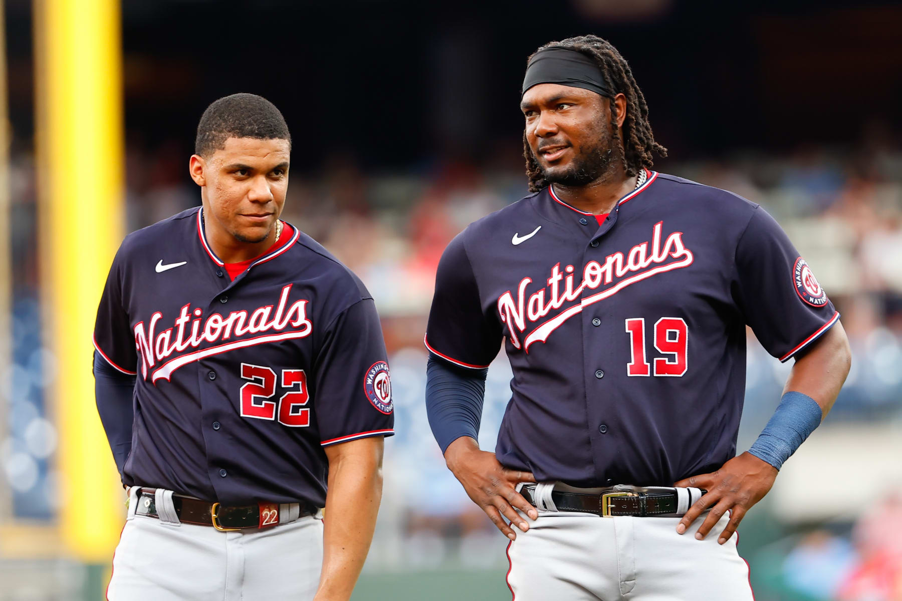 PHILADELPHIA, PA - JULY 07:  Washington Nationals right fielder Juan Soto (22) and Washington Nationals first baseman Josh Bell (19) during the Major League Baseball game between the Philadelphia Phillies and the Washington Nationals on July 7, 2022 at Citizens Bank Park in Philadelphia, Pennsylvania.  (Photo by Rich Graessle/Icon Sportswire via Getty Images)