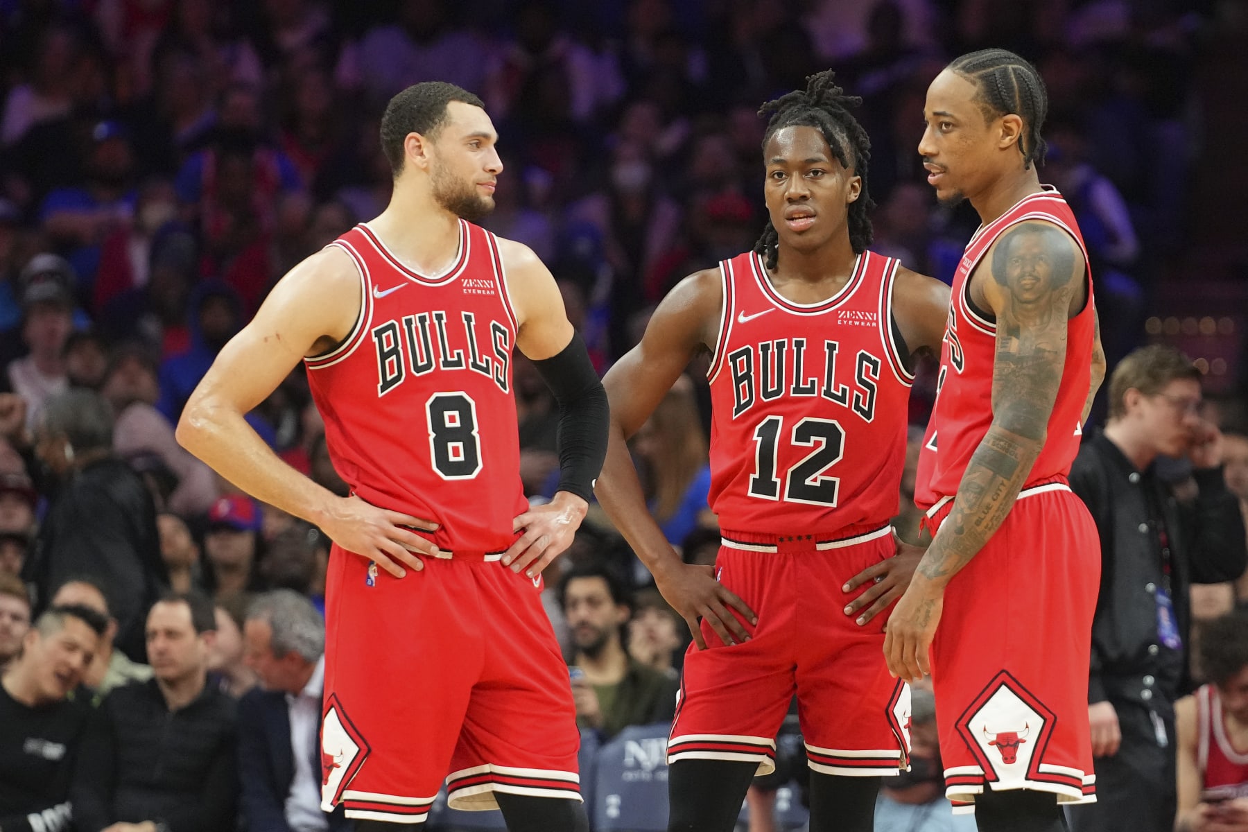 PHILADELPHIA, PA - MARCH 07: Zach LaVine #8 of the Chicago Bulls talks with Ayo Dosunmu #12 and DeMar DeRozan #11 against the Philadelphia 76ers at the Wells Fargo Center on March 7, 2022 in Philadelphia, Pennsylvania. The 76ers defeated the Bulls 121-106. NOTE TO USER: User expressly acknowledges and agrees that, by downloading and or using this photograph, User is consenting to the terms and conditions of the Getty Images License Agreement. (Photo by Mitchell Leff/Getty Images)