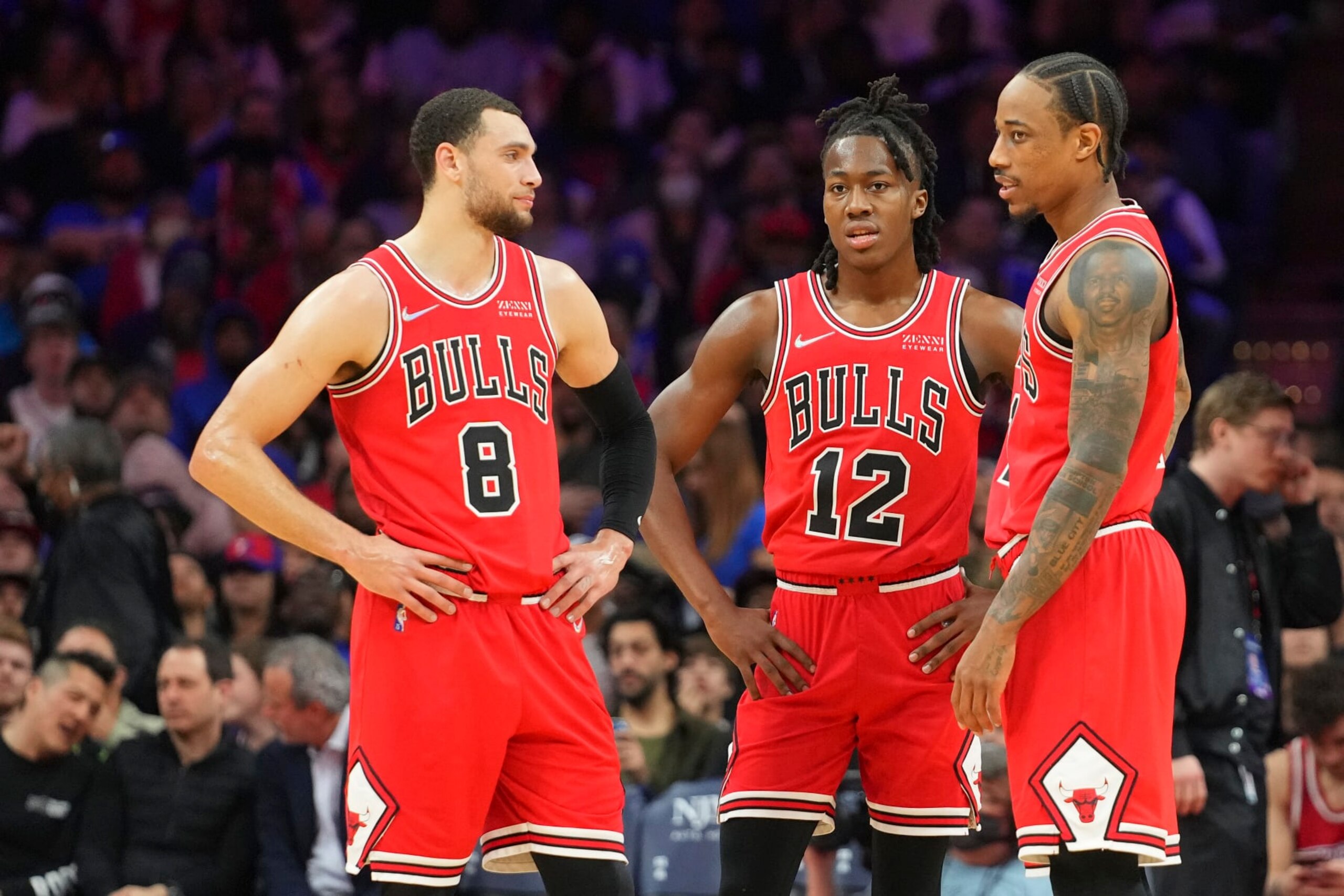 PHILADELPHIA, PA - MARCH 07: Zach LaVine #8 of the Chicago Bulls talks with Ayo Dosunmu #12 and DeMar DeRozan #11 against the Philadelphia 76ers at the Wells Fargo Center on March 7, 2022 in Philadelphia, Pennsylvania. The 76ers defeated the Bulls 121-106. NOTE TO USER: User expressly acknowledges and agrees that, by downloading and or using this photograph, User is consenting to the terms and conditions of the Getty Images License Agreement. (Photo by Mitchell Leff/Getty Images)