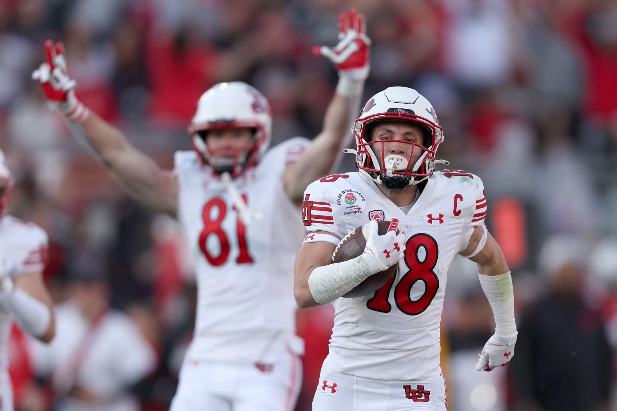 PASADENA, CALIFORNIA - JANUARY 01: Britain Covey #18 of the Utah Utes rushes for a touchdown against the Ohio State Buckeyes during the second quarter in the Rose Bowl Game at  at Rose Bowl Stadium on January 01, 2022 in Pasadena, California. (Photo by Sean M. Haffey/Getty Images)