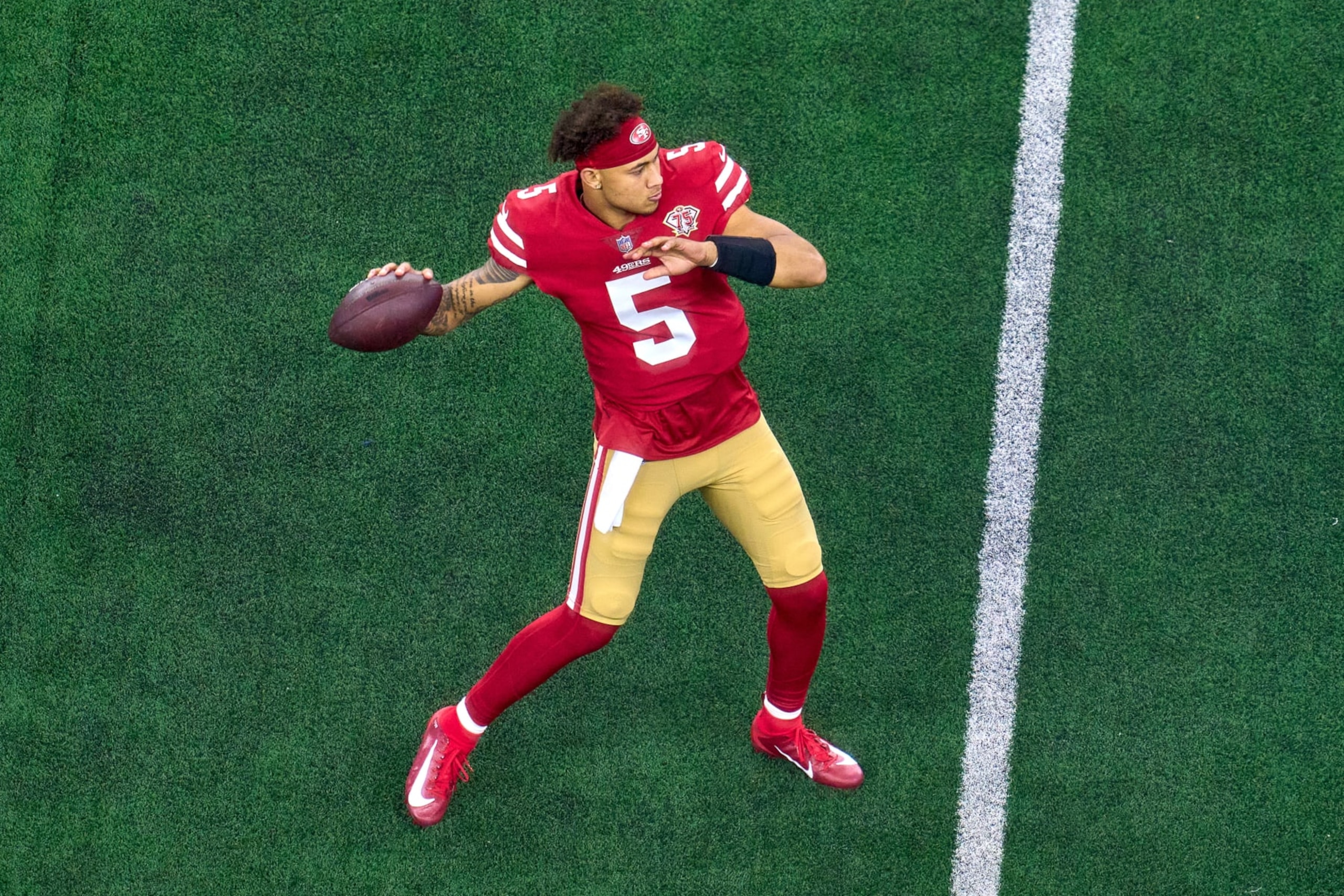 ARLINGTON, TX - JANUARY 16: San Francisco 49ers quarterback Trey Lance (5) warms up with the football during the NFC Wild Card game between the San Francisco 49ers and the Dallas Cowboys on January 16, 2022 at AT&T Stadium in Arlington, TX. (Photo by Robin Alam/Icon Sportswire via Getty Images)