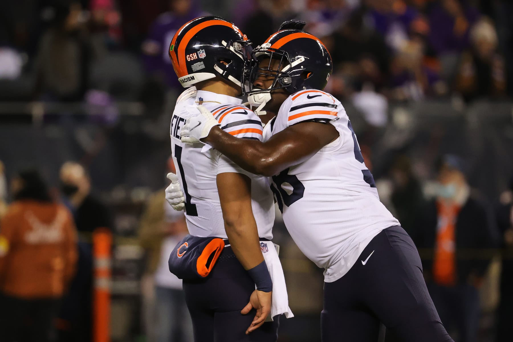 CHICAGO, ILLINOIS - DECEMBER 20: Justin Fields #1 of the Chicago Bears and Roquan Smith #58 of the Chicago Bears embrace each other prior to playing the against the Minnesota Vikings at Soldier Field on December 20, 2021 in Chicago, Illinois. (Photo by Jonathan Daniel/Getty Images)