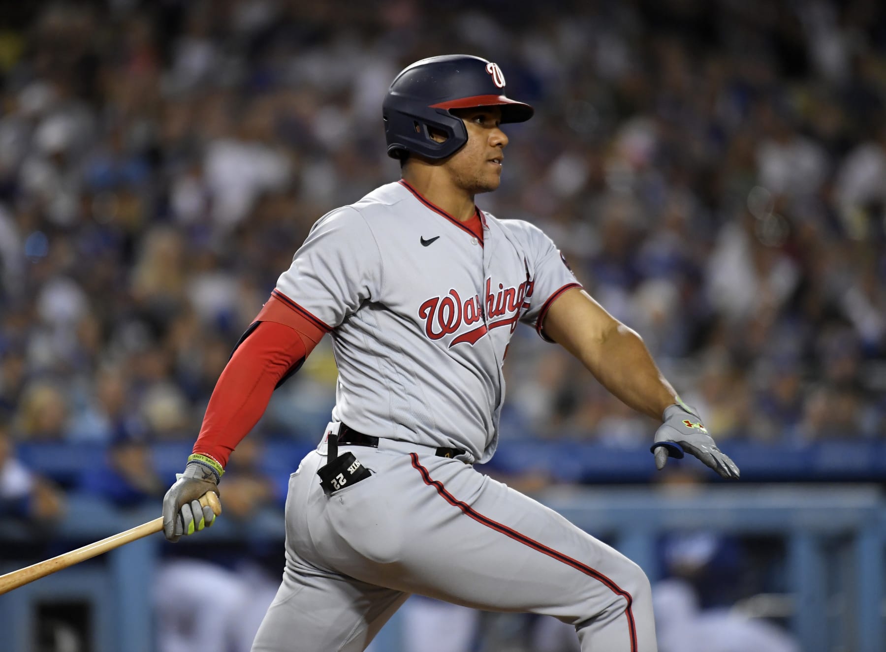 LOS ANGELES, CA - JULY 25: Juan Soto #22 of the Washington Nationals hits a two-run triple to score Cesar Hernandez #1 and Victor Robles #16 against starting pitcher Tony Gonsolin #26 of the Los Angeles Dodgers during the fifth inning at Dodger Stadium on July 25, 2022 in Los Angeles, California. (Photo by Kevork Djansezian/Getty Images)