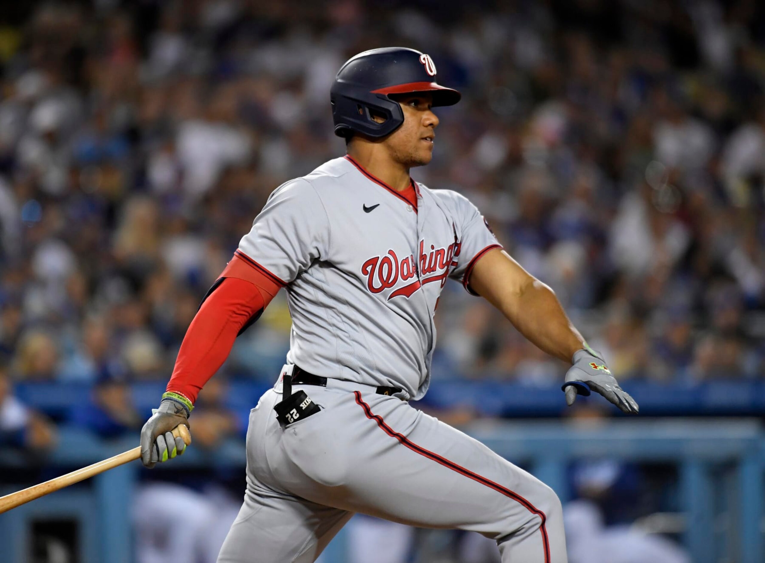 LOS ANGELES, CA - JULY 25: Juan Soto #22 of the Washington Nationals hits a two-run triple to score Cesar Hernandez #1 and Victor Robles #16 against starting pitcher Tony Gonsolin #26 of the Los Angeles Dodgers during the fifth inning at Dodger Stadium on July 25, 2022 in Los Angeles, California. (Photo by Kevork Djansezian/Getty Images)