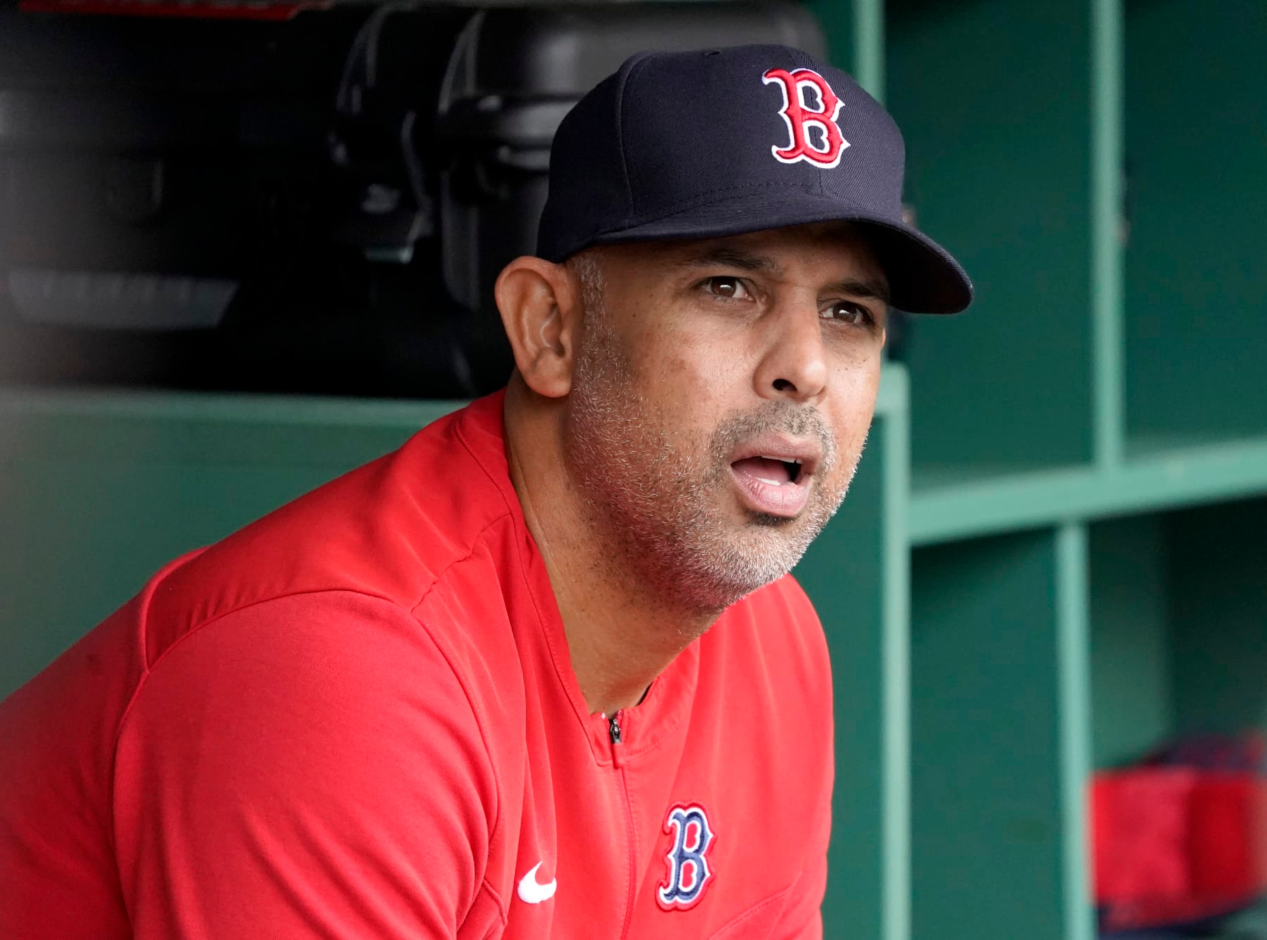 Boston Red Sox manager Alex Cora looks out from the dugout before the start of a baseball game against the Oakland Athletics at Fenway Park, Thursday, June 16, 2022, in Boston. (AP Photo/Mary Schwalm)
