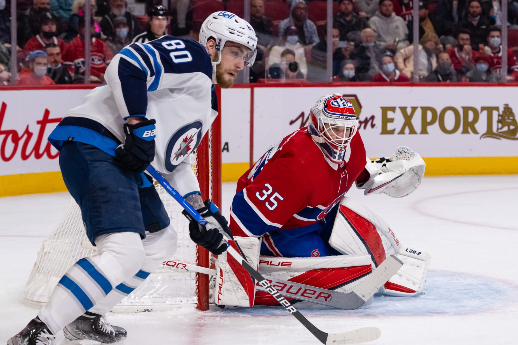 MONTREAL, QC - APRIL 11: dSam Montembeault (35) of the Montreal Canadiens makes the save against Pierre-Luc Dubois (80) of the Winnipeg Jets uring the first period of the NHL game between the Winnipeg Jets and the Montreal Canadiens on April 11, 2022, at the Bell Centre in Montreal, QC(Photo by Vincent Ethier/Icon Sportswire via Getty Images)