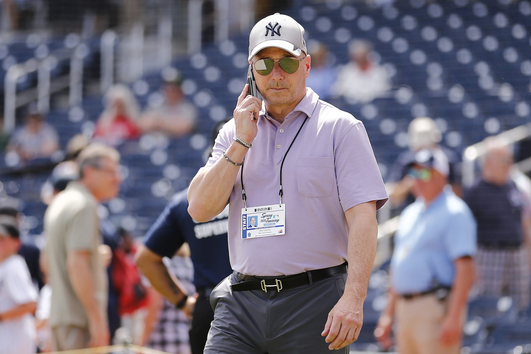 WEST PALM BEACH, FLORIDA - MARCH 12:  New York Yankees general manager Brian Cashman talks on the phone prior to a Grapefruit League spring training game between the Washington Nationals and the New York Yankees at FITTEAM Ballpark of The Palm Beaches on March 12, 2020 in West Palm Beach, Florida. Many professional and college sports are canceling or postponing their games due to the ongoing threat of the Coronavirus (COVID-19) outbreak. (Photo by Michael Reaves/Getty Images)
