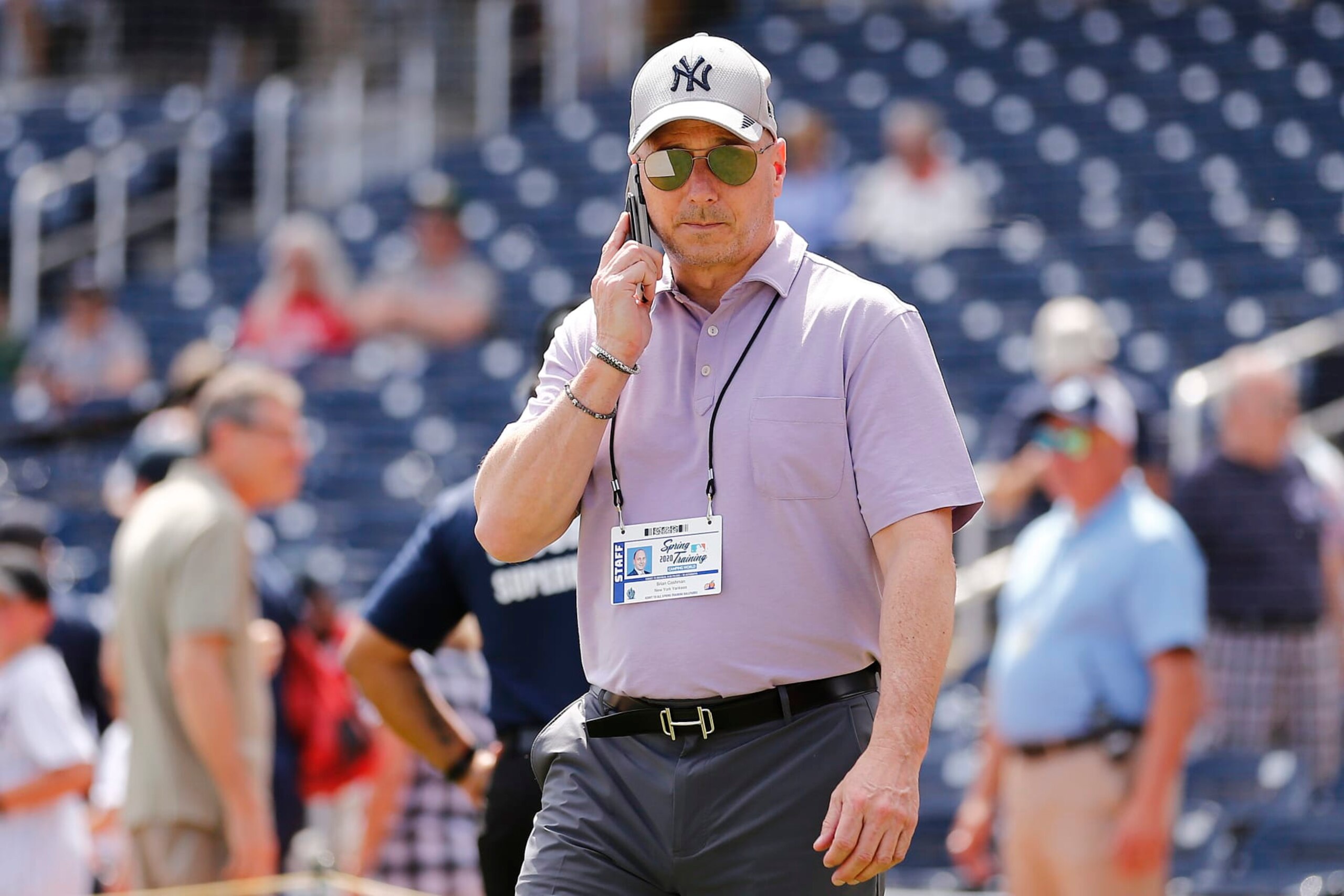 WEST PALM BEACH, FLORIDA - MARCH 12:  New York Yankees general manager Brian Cashman talks on the phone prior to a Grapefruit League spring training game between the Washington Nationals and the New York Yankees at FITTEAM Ballpark of The Palm Beaches on March 12, 2020 in West Palm Beach, Florida. Many professional and college sports are canceling or postponing their games due to the ongoing threat of the Coronavirus (COVID-19) outbreak. (Photo by Michael Reaves/Getty Images)