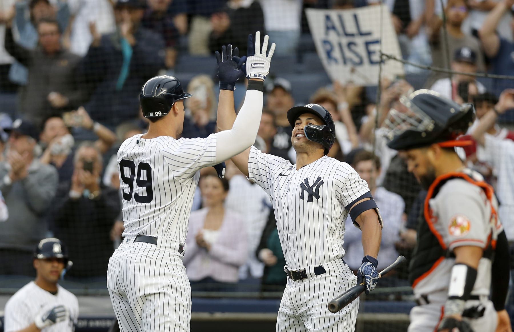 NEW YORK, NEW YORK - MAY 23: Aaron Judge #99 of the New York Yankees celebrates his home run during the first inning against the Baltimore Orioles with teammate Giancarlo Stanton #27 at Yankee Stadium on May 23, 2022 in New York City. (Photo by Jim McIsaac/Getty Images)