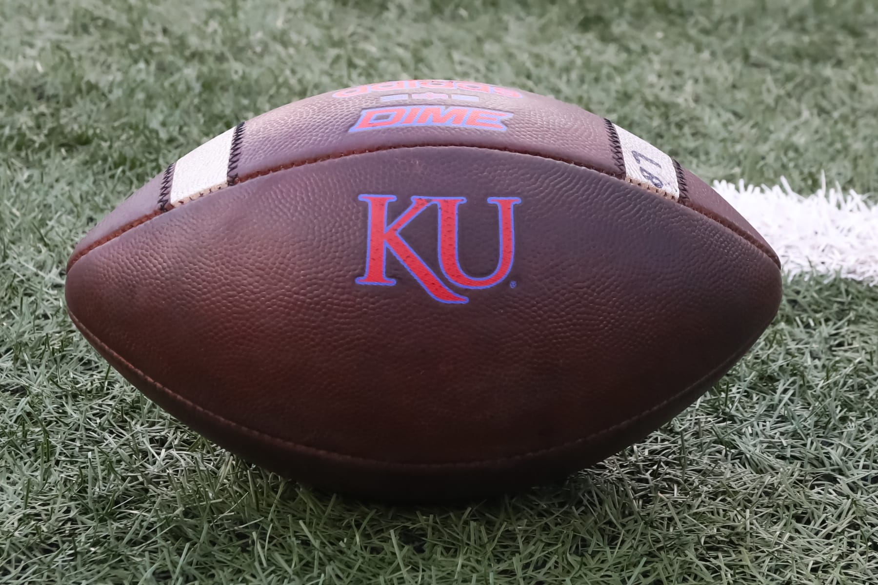 LAWRENCE, KS - SEPTEMBER 03: A view of a football with the KU logo before a college football game between the South Dakota Coyotes and Kansas Jayhawks on Sep 3, 2021 at Memorial Stadium in Lawrence, KS. (Photo by Scott Winters/Icon Sportswire via Getty Images)