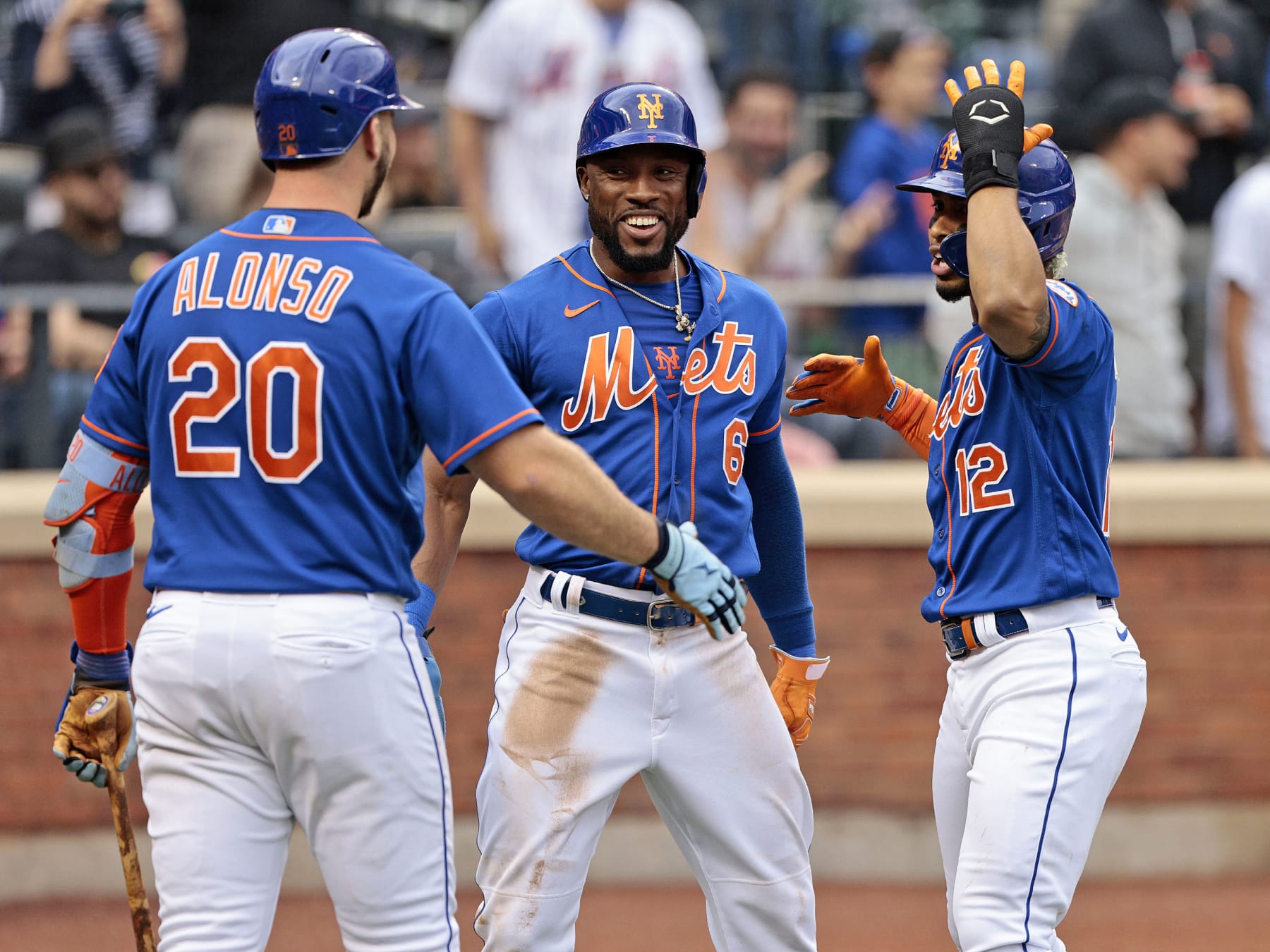 NEW YORK, NY - JUNE 18: Francisco Lindor #12 of the New York Mets is congratulated by teammates Starling Marte #6 and Pete Alonso #20 after hitting a two run homerun in the bottom of the third inning against the Miami Marlins at Citi Field on June 18, 2022 in New York City. (Photo by Christopher Pasatieri/Getty Images)