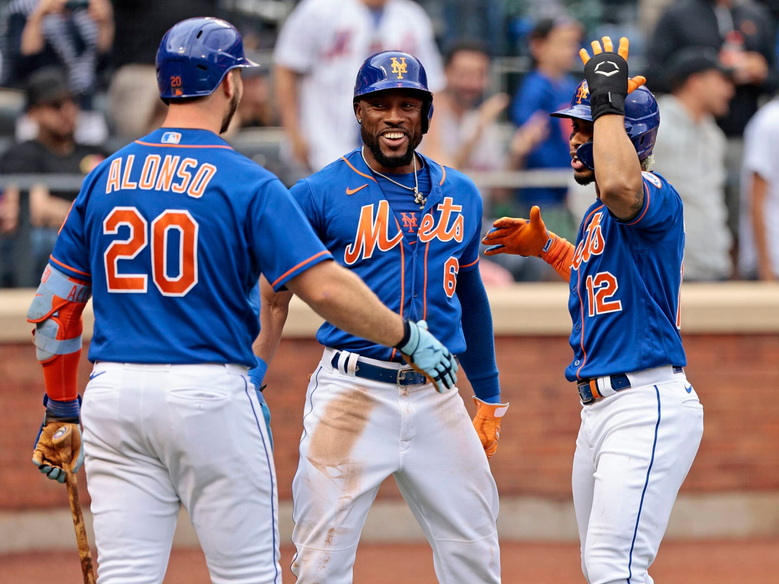 NEW YORK, NY - JUNE 18: Francisco Lindor #12 of the New York Mets is congratulated by teammates Starling Marte #6 and Pete Alonso #20 after hitting a two run homerun in the bottom of the third inning against the Miami Marlins at Citi Field on June 18, 2022 in New York City. (Photo by Christopher Pasatieri/Getty Images)