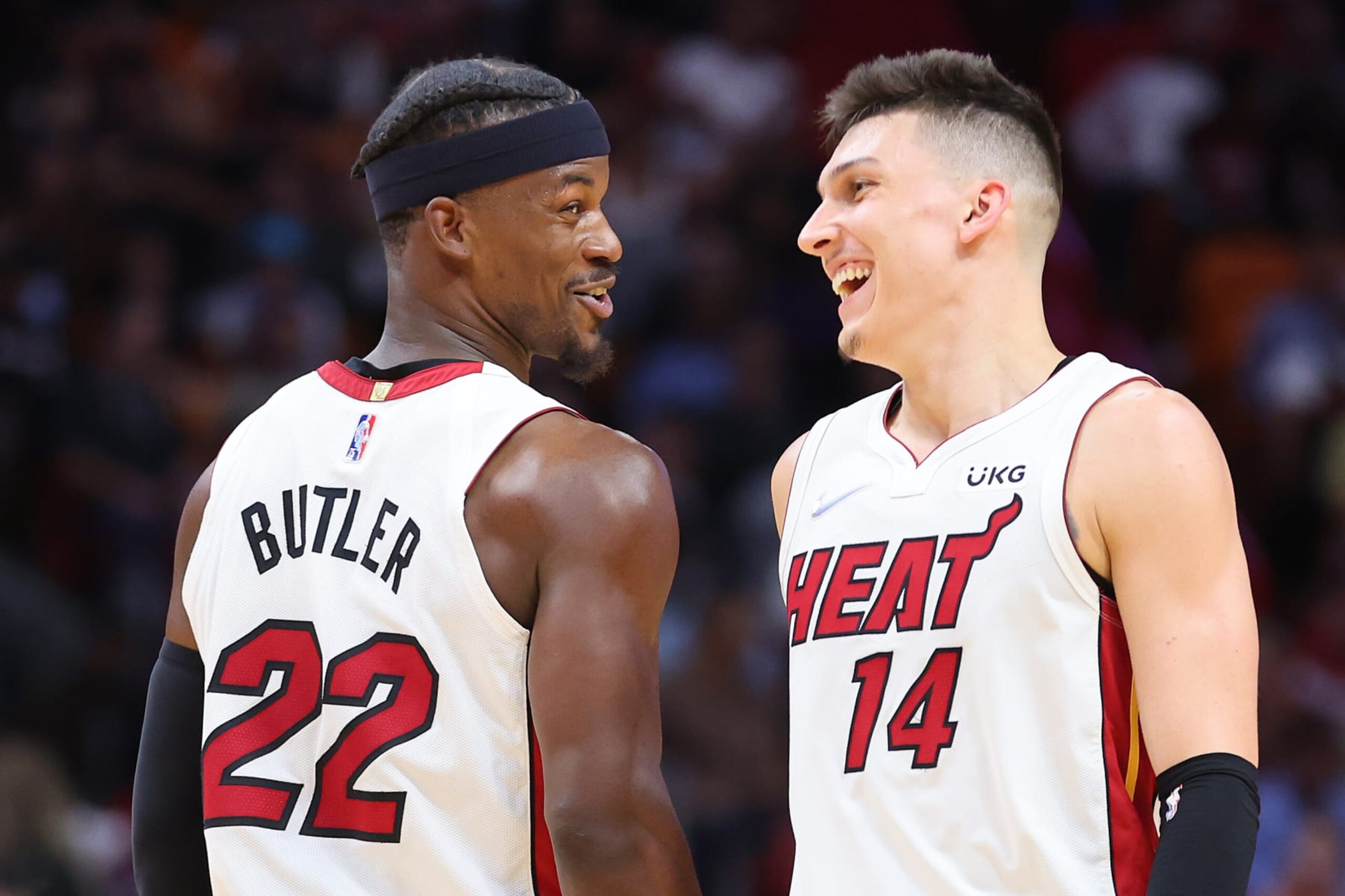 MIAMI, FLORIDA - APRIL 05: Jimmy Butler #22 and Tyler Herro #14 of the Miami Heat celebrate against the Charlotte Hornets during the second half at FTX Arena on April 05, 2022 in Miami, Florida. NOTE TO USER: User expressly acknowledges and agrees that, by downloading and or using this photograph, User is consenting to the terms and conditions of the Getty Images License Agreement.  (Photo by Michael Reaves/Getty Images)