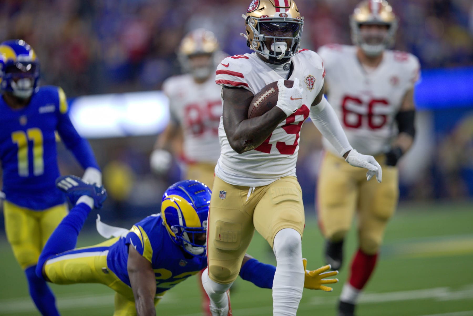 INGLEWOOD, CA - JANUARY 30: Deebo Samuel #19 of the San Francisco 49ers heads to the end zone on a 44-yard touchdown catch during the game against the Los Angeles Rams at SoFi Stadium on January 30, 2022 in Inglewood, California. The Rams defeated the 49ers 20-17. (Photo by Michael Zagaris/San Francisco 49ers/Getty Images)
