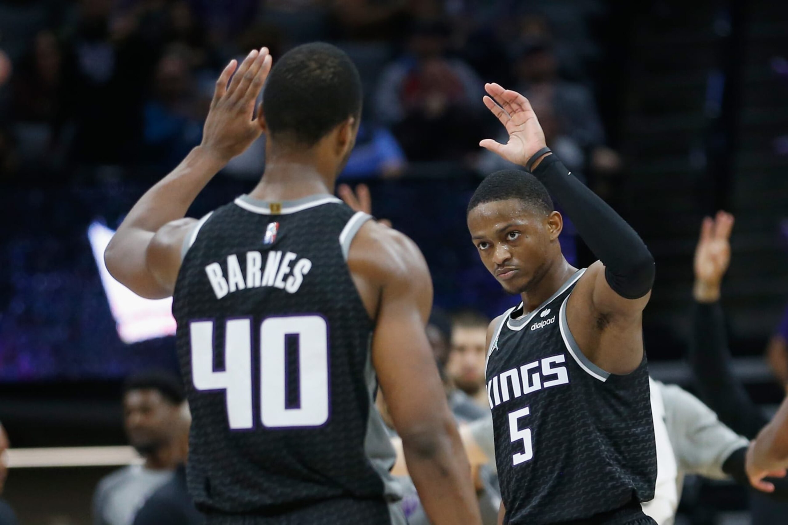 SACRAMENTO, CALIFORNIA - MARCH 09: De'Aaron Fox #5 of the Sacramento Kings celebrates with Harrison Barnes #40 after making a three-point basket in the third quarter against the Denver Nuggets at Golden 1 Center on March 09, 2022 in Sacramento, California. NOTE TO USER: User expressly acknowledges and agrees that, by downloading and/or using this photograph, User is consenting to the terms and conditions of the Getty Images License Agreement. (Photo by Lachlan Cunningham/Getty Images)