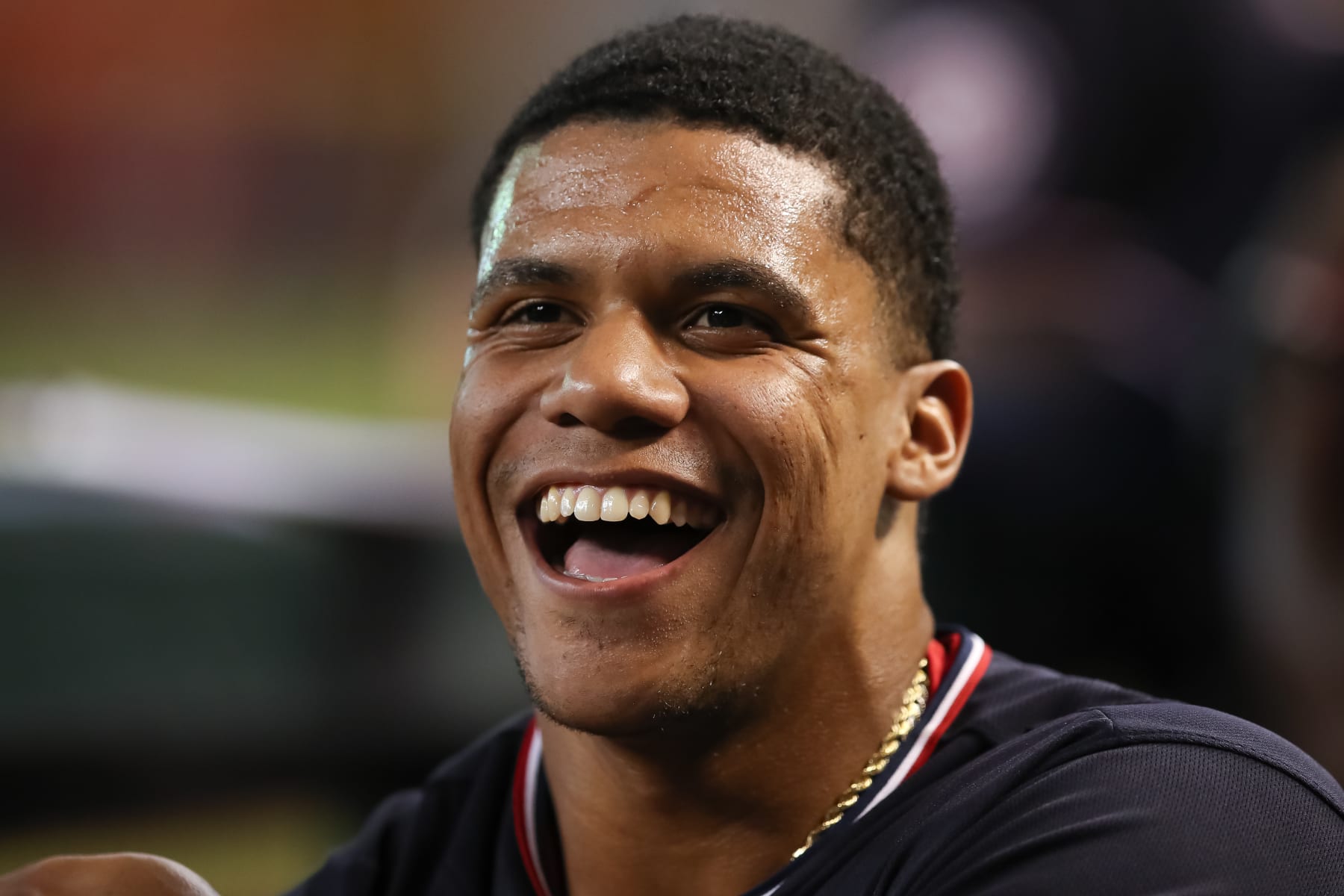 PHOENIX, AZ - JULY 22: Juan Soto #22 of the Washington Nationals smiles in the dugout before the MLB game against the Arizona Diamondbacks at Chase Field on July 22, 2022 in Phoenix, Arizona. (Photo by Mike Christy/Getty Images)