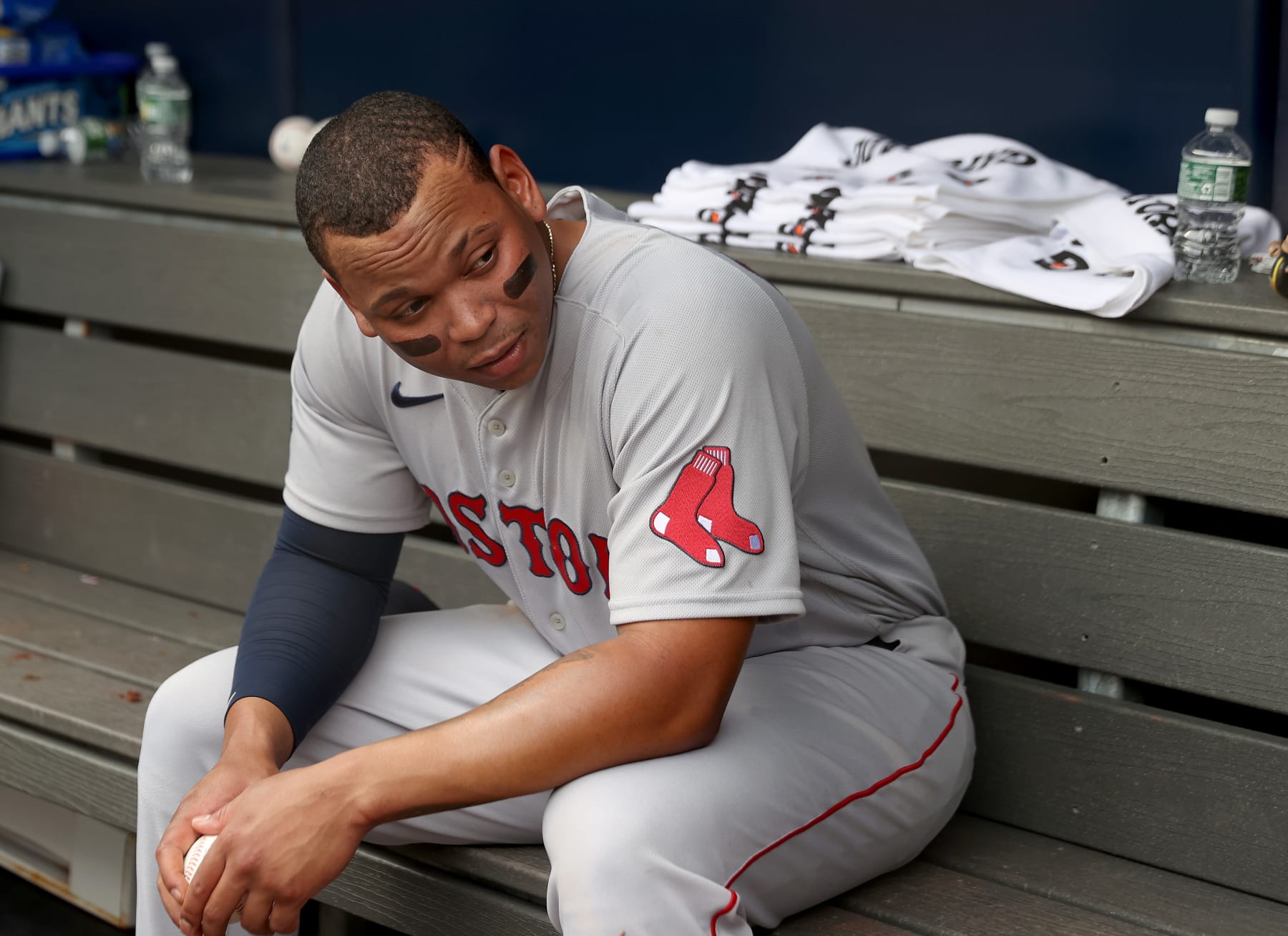 NEW YORK, NEW YORK - JULY 17:  Rafael Devers #11 of the Boston Red Sox sits in the dugout in the first inning after teammate Chris Sale left the game injured against the New York Yankees at Yankee Stadium on July 17, 2022 in the Bronx borough of New York City. (Photo by Elsa/Getty Images)