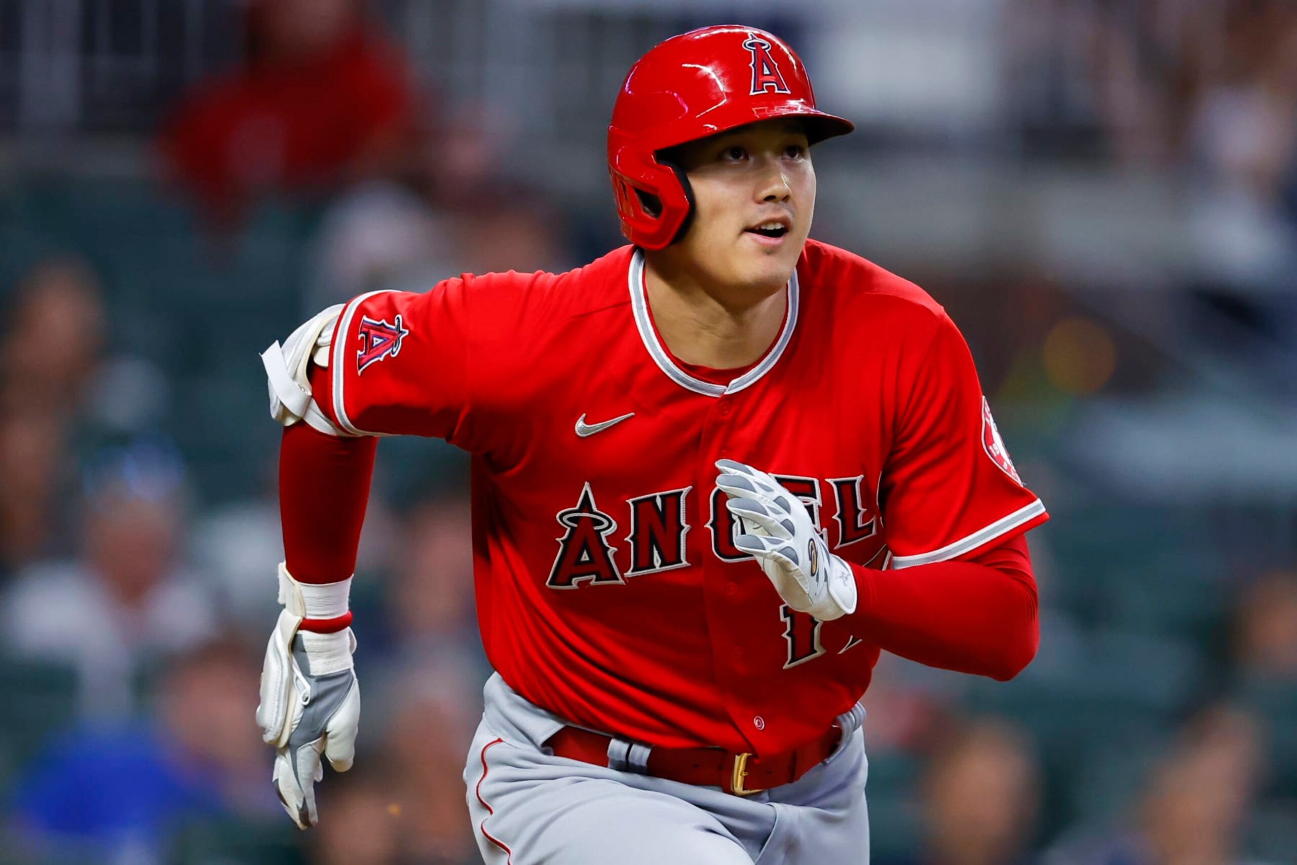 ATLANTA, GA - JULY 23: Shohei Ohtani #17 of the Los Angeles Angels watches the ball as it goes deep for a home run during the fifth inning against the Atlanta Braves at Truist Park on July 23, 2022 in Atlanta, Georgia. (Photo by Todd Kirkland/Getty Images)