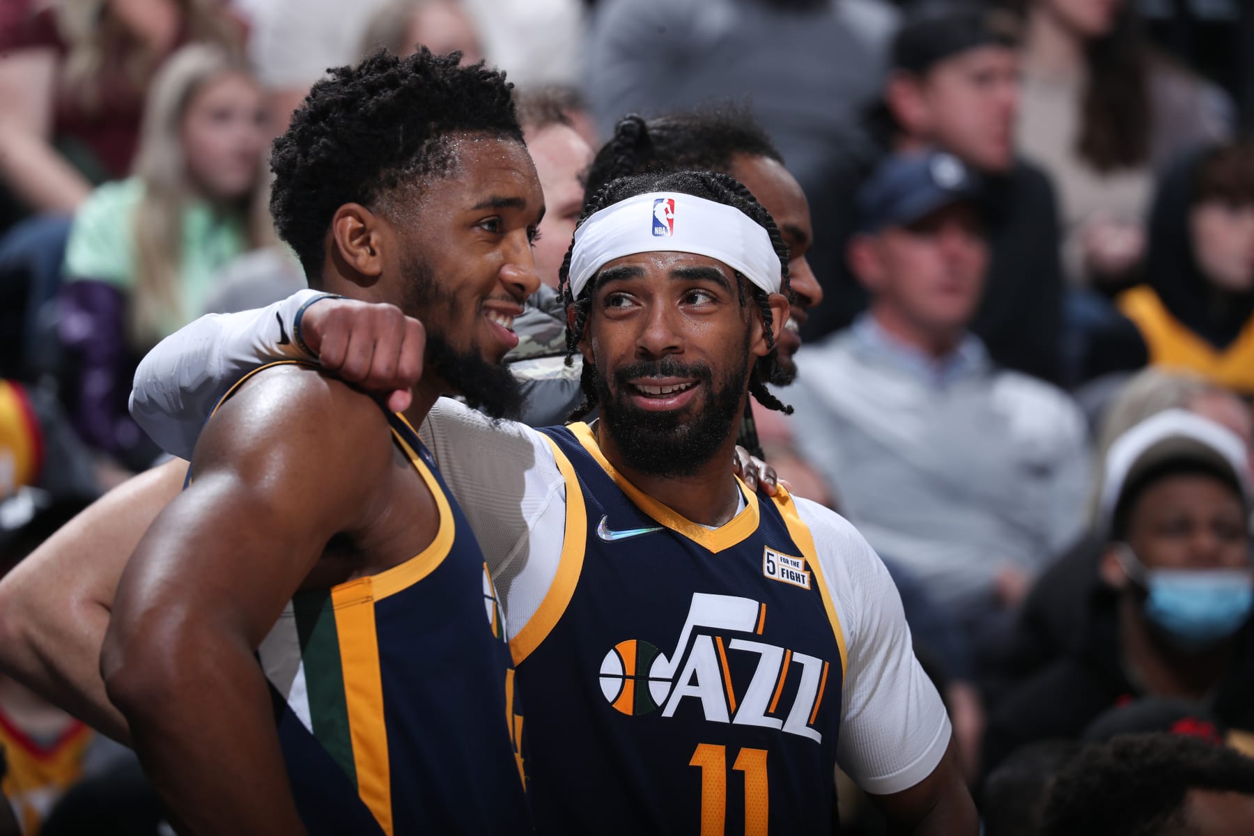 SALT LAKE CITY, UT - FEBRUARY 11: Donovan Mitchell #45 and Mike Conley #11 of the Utah Jazz look on and smiles during the game against the Orlando Magic on February 11, 2022 at vivint.SmartHome Arena in Salt Lake City, Utah. NOTE TO USER: User expressly acknowledges and agrees that, by downloading and or using this Photograph, User is consenting to the terms and conditions of the Getty Images License Agreement. Mandatory Copyright Notice: Copyright 2022 NBAE (Photo by Melissa Majchrzak/NBAE via Getty Images)