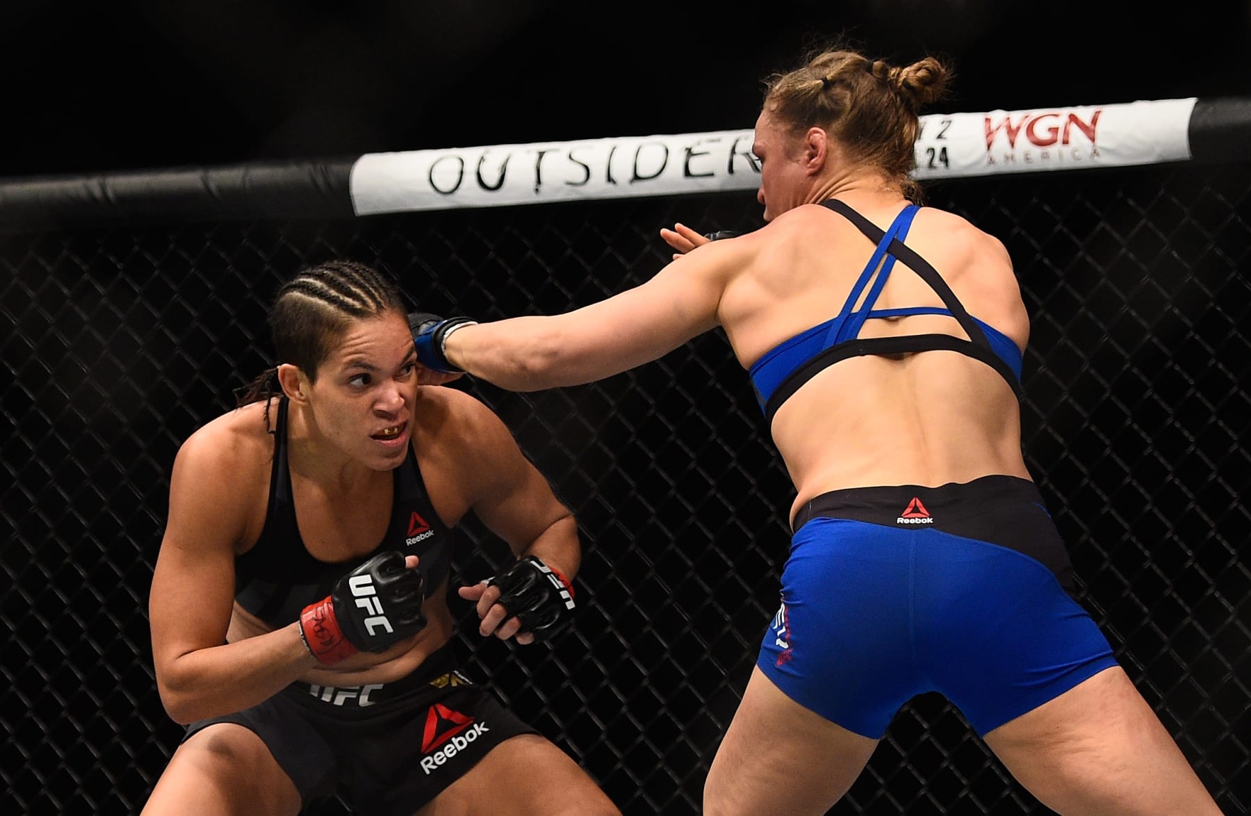 LAS VEGAS, NV - DECEMBER 30: (R-L) Ronda Rousey punches Amanda Nunes of Brazil in their UFC women's bantamweight championship bout during the UFC 207 event at T-Mobile Arena on December 30, 2016 in Las Vegas, Nevada.  (Photo by Jeff Bottari/Zuffa LLC/Zuffa LLC via Getty Images)