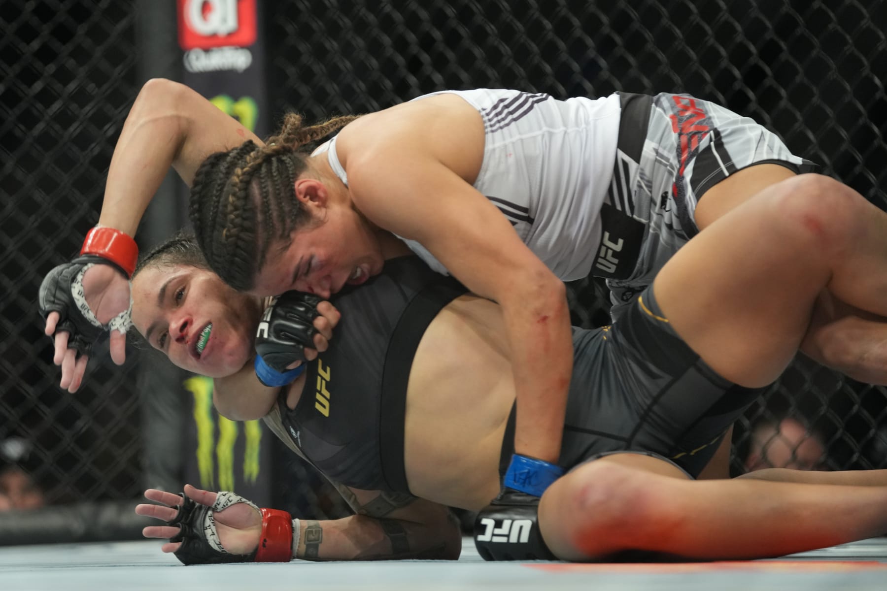 LAS VEGAS, NV - DECEMBER 11: (R-L) Julianna Peña attempts to submit Amanda Nunes in their womans bantamweight title fight during the UFC 269 on December 11, 2021, at T-Mobile Arena in Las Vegas, NV. (Photo by Louis Grasse/PxImages/Icon Sportswire via Getty Images)