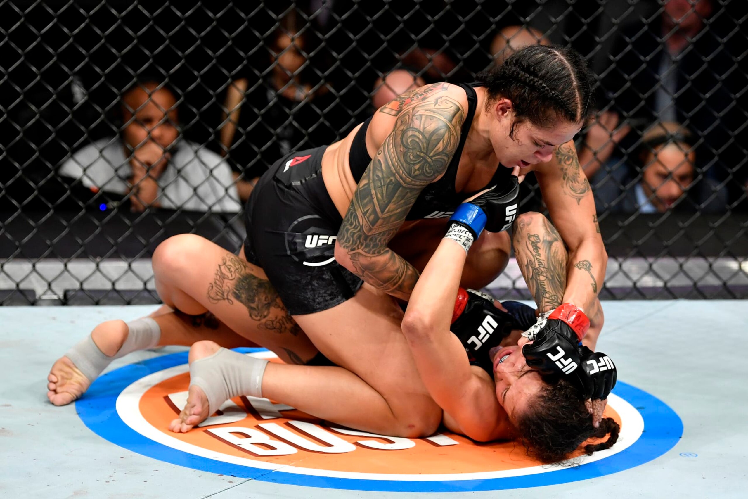 LAS VEGAS, NEVADA - DECEMBER 14:  Amanda Nunes of Brazil (top) strikes Germaine de Randamie of Netherlands in their UFC women's bantamweight championship bout during the UFC 245 event at T-Mobile Arena on December 14, 2019 in Las Vegas, Nevada. (Photo by Jeff Bottari/Zuffa LLC)