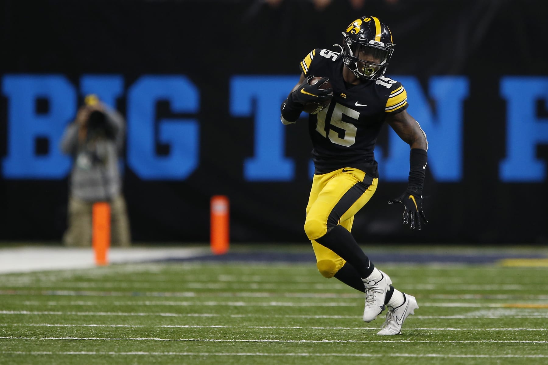 INDIANAPOLIS, IN - DECEMBER 04: Iowa Hawkeyes running back Tyler Goodson (15) heads up field during the Big 10 Conference Championship between the Iowa Hawkeyes and Michigan Wolverines on December 04, 2021 at Lucas Oil Stadium in Indianapolis, IN. (Photo by Jeffrey Brown/Icon Sportswire via Getty Images)