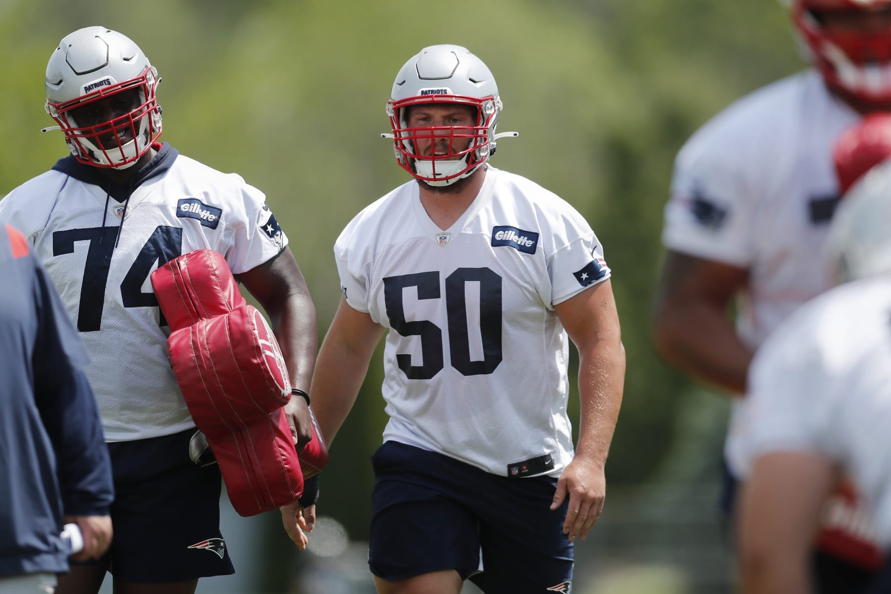New England Patriots offensive lineman Cole Strange (50) takes part in drills at the NFL football team's practice facility in Foxborough, Mass., Tuesday, May 31, 2022 (AP Photo/Michael Dwyer)