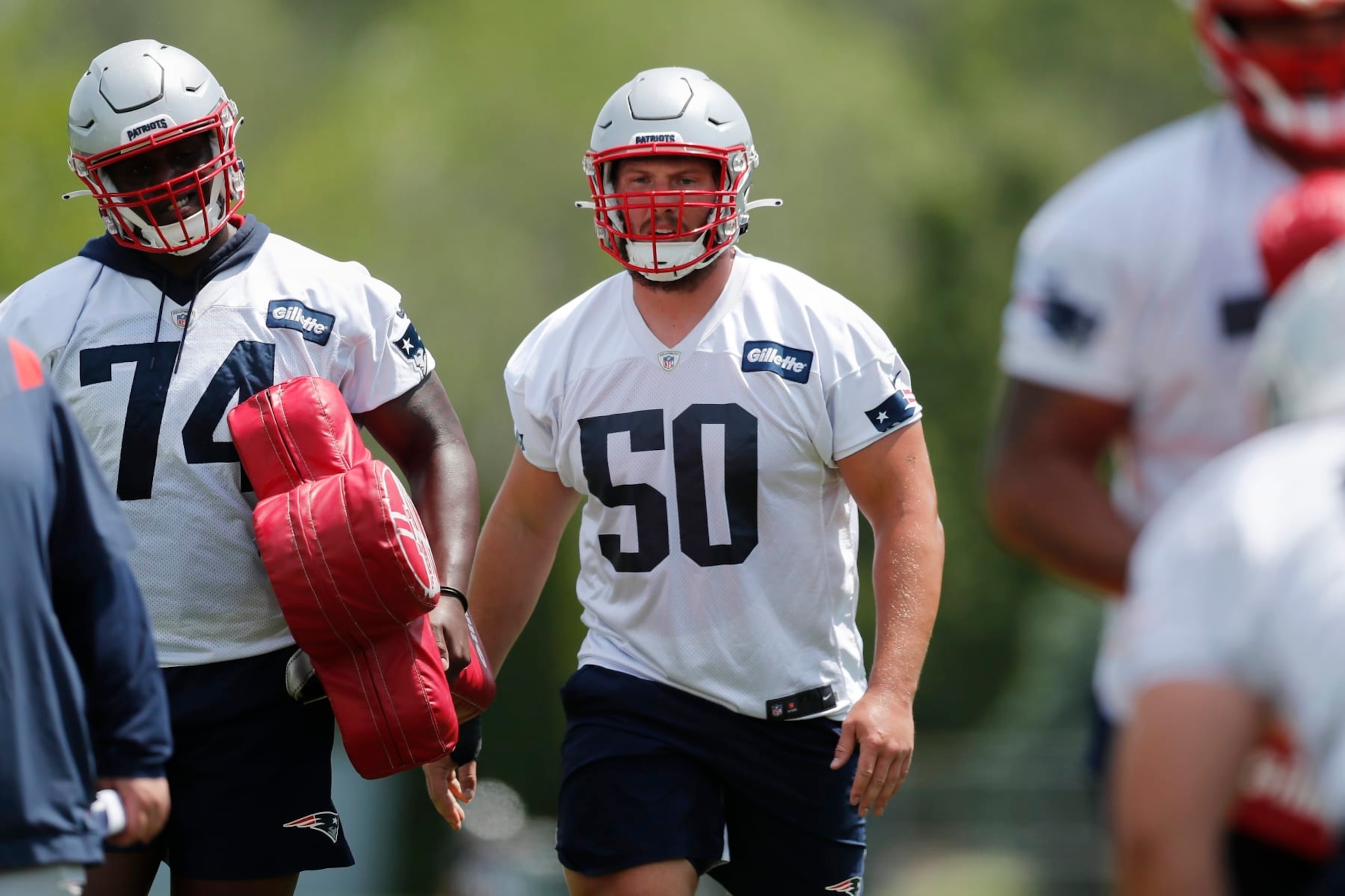 New England Patriots offensive lineman Cole Strange (50) takes part in drills at the NFL football team's practice facility in Foxborough, Mass., Tuesday, May 31, 2022 (AP Photo/Michael Dwyer)
