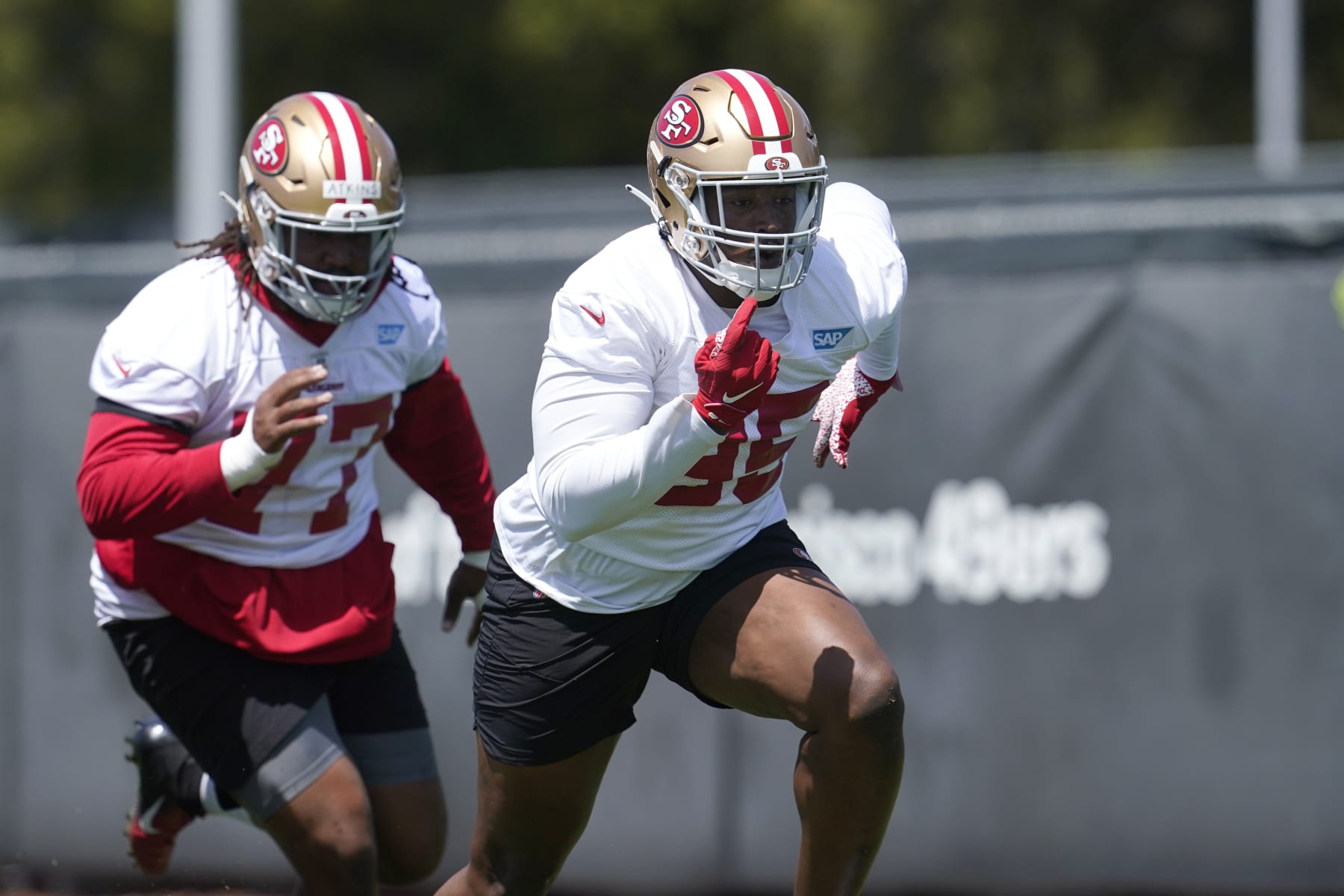 San Francisco 49ers defensive lineman Kevin Atkins, left, and defensive lineman Drake Jackson take part in drills at the NFL football team's practice facility in Santa Clara, Calif., Tuesday, June 7, 2022. (AP Photo/Jeff Chiu)