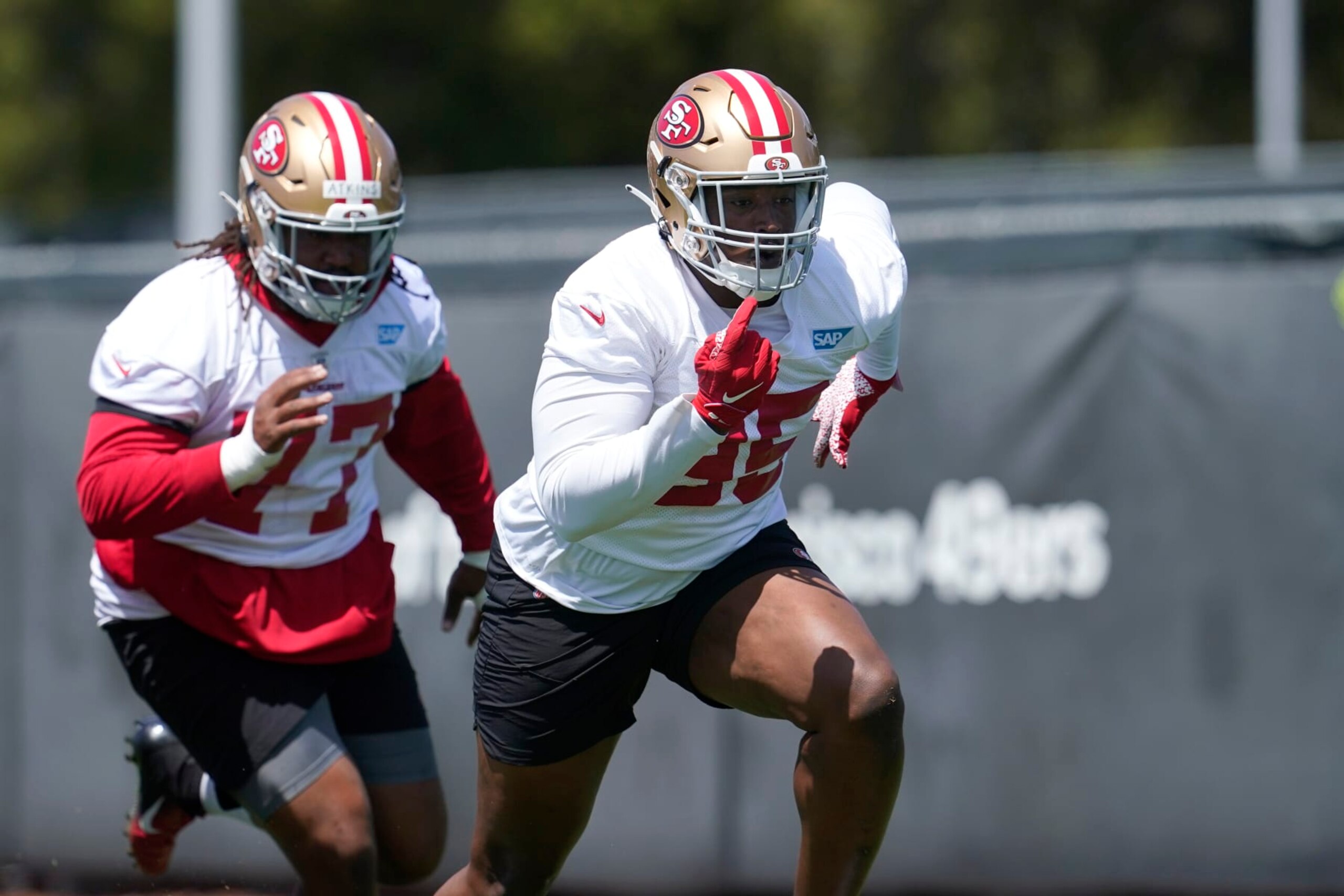 San Francisco 49ers defensive lineman Kevin Atkins, left, and defensive lineman Drake Jackson take part in drills at the NFL football team's practice facility in Santa Clara, Calif., Tuesday, June 7, 2022. (AP Photo/Jeff Chiu)