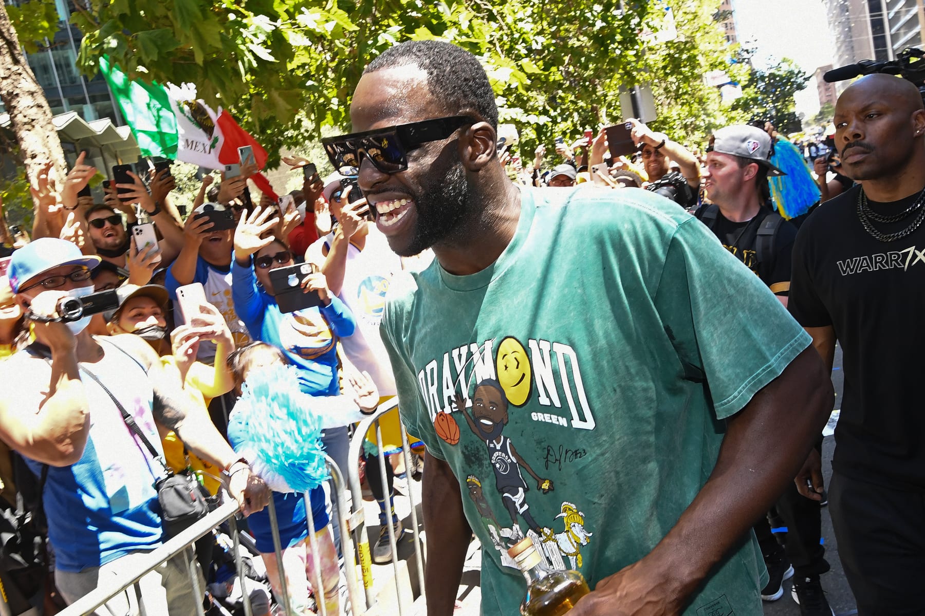 SAN FRANCISCO, CA - JUNE 20: Draymond Green #23 of the Golden State Warriors celebrates during their 2022 Victory Parade & Rally on June 20, 2022 at Chase Center in San Francisco, California. NOTE TO USER: User expressly acknowledges and agrees that, by downloading and or using this photograph, user is consenting to the terms and conditions of Getty Images License Agreement. Mandatory Copyright Notice: Copyright 2022 NBAE (Photo by Noah Graham/NBAE via Getty Images)