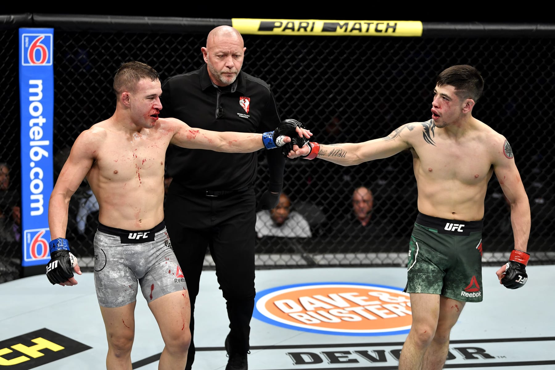 LAS VEGAS, NEVADA - DECEMBER 14:  (L-R) Kai Kara-France of New Zealand touches gloves with Brandon Moreno of Mexico in their flyweight bout during the UFC 245 event at T-Mobile Arena on December 14, 2019 in Las Vegas, Nevada. (Photo by Jeff Bottari/Zuffa LLC)