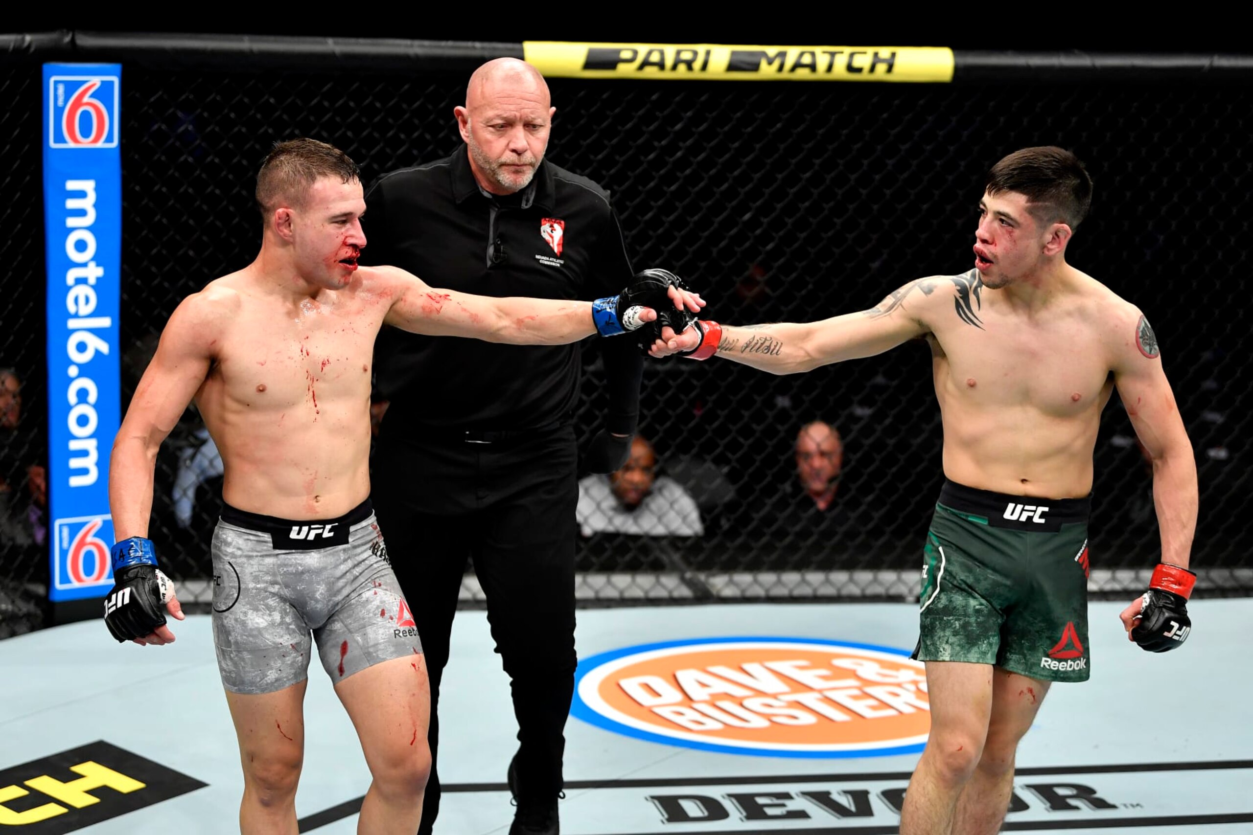 LAS VEGAS, NEVADA - DECEMBER 14:  (L-R) Kai Kara-France of New Zealand touches gloves with Brandon Moreno of Mexico in their flyweight bout during the UFC 245 event at T-Mobile Arena on December 14, 2019 in Las Vegas, Nevada. (Photo by Jeff Bottari/Zuffa LLC)