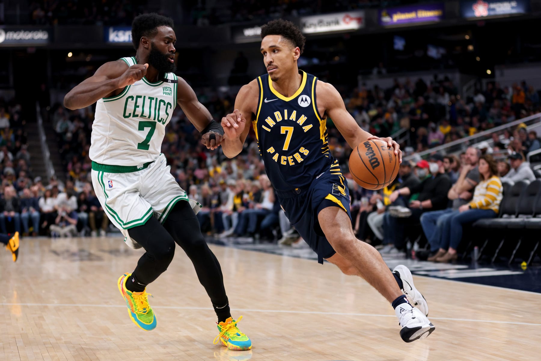 INDIANAPOLIS, INDIANA - FEBRUARY 27: Malcolm Brogdon #7 of the Indiana Pacers dribbles the ball while being guarded by Jaylen Brown #7 of the Boston Celtics in the third quarter at Gainbridge Fieldhouse on February 27, 2022 in Indianapolis, Indiana. NOTE TO USER: User expressly acknowledges and agrees that, by downloading and or using this Photograph, user is consenting to the terms and conditions of the Getty Images License Agreement. (Photo by Dylan Buell/Getty Images) INDIANAPOLIS, INDIANA - FEBRUARY 27: Malcolm Brogdon #7 of the Indiana Pacers dribbles the ball while being guarded by Jaylen Brown #7 of the Boston Celtics in the third quarter at Gainbridge Fieldhouse on February 27, 2022 in Indianapolis, Indiana. NOTE TO USER: User expressly acknowledges and agrees that, by downloading and or using this Photograph, user is consenting to the terms and conditions of the Getty Images License Agreement. (Photo by Dylan Buell/Getty Images)