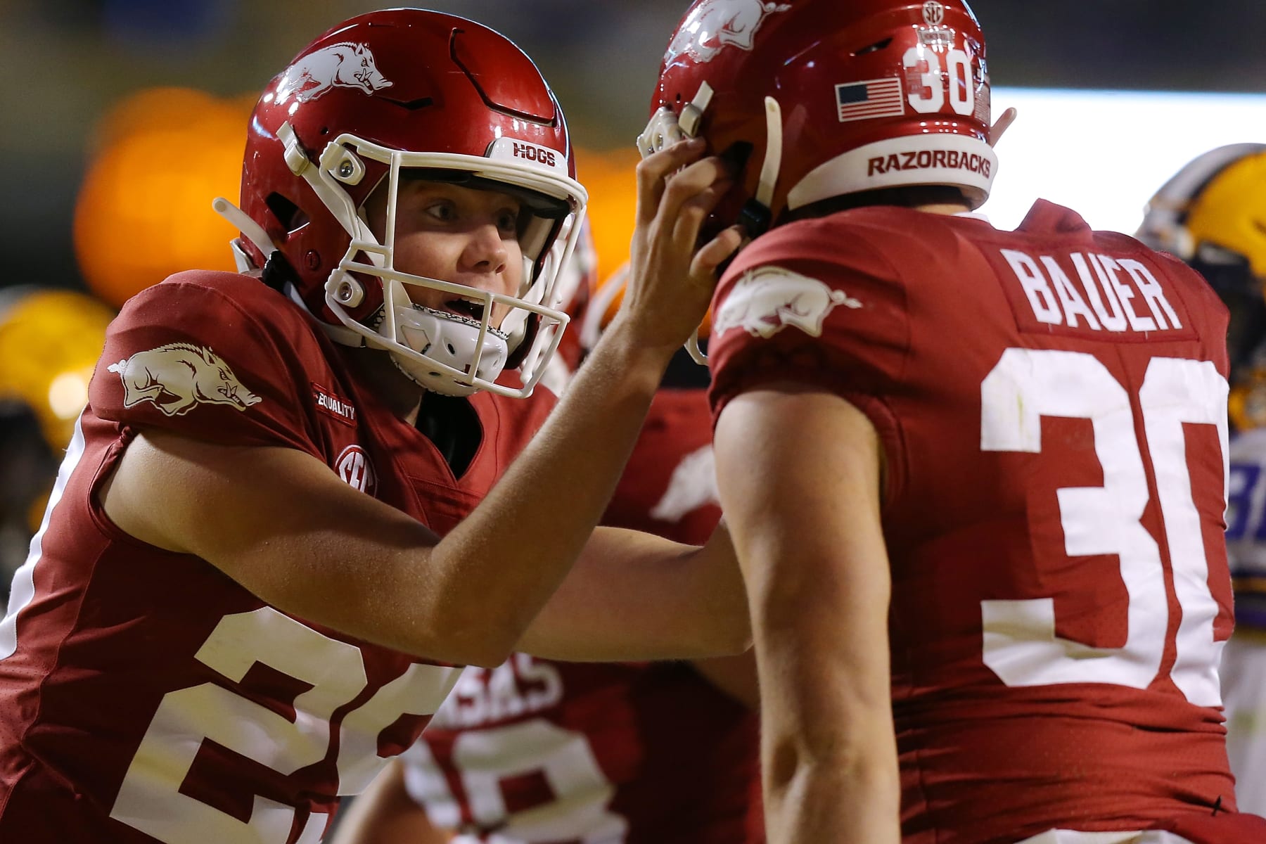 BATON ROUGE, LOUISIANA - NOVEMBER 13: Cam Little #29 of the Arkansas Razorbacks celebrates a fake field goal for a first down with Reid Bauer #30 of the Arkansas Razorbacks during the second half against the LSU Tigers at Tiger Stadium on November 13, 2021 in Baton Rouge, Louisiana. (Photo by Jonathan Bachman/Getty Images)