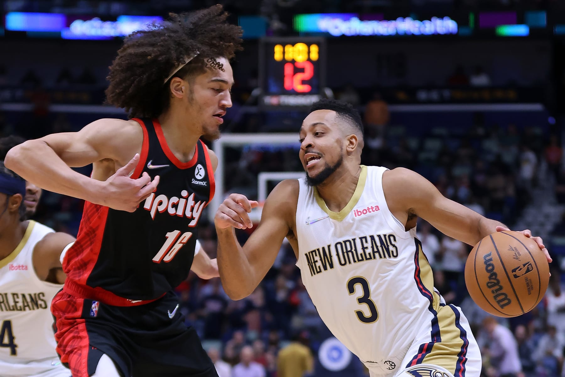 NEW ORLEANS, LOUISIANA - APRIL 07: CJ McCollum #3 of the New Orleans Pelicans drives against CJ Elleby #16 of the Portland Trail Blazers during the first half at the Smoothie King Center on April 07, 2022 in New Orleans, Louisiana. NOTE TO USER: User expressly acknowledges and agrees that, by downloading and or using this Photograph, user is consenting to the terms and conditions of the Getty Images License Agreement. (Photo by Jonathan Bachman/Getty Images)