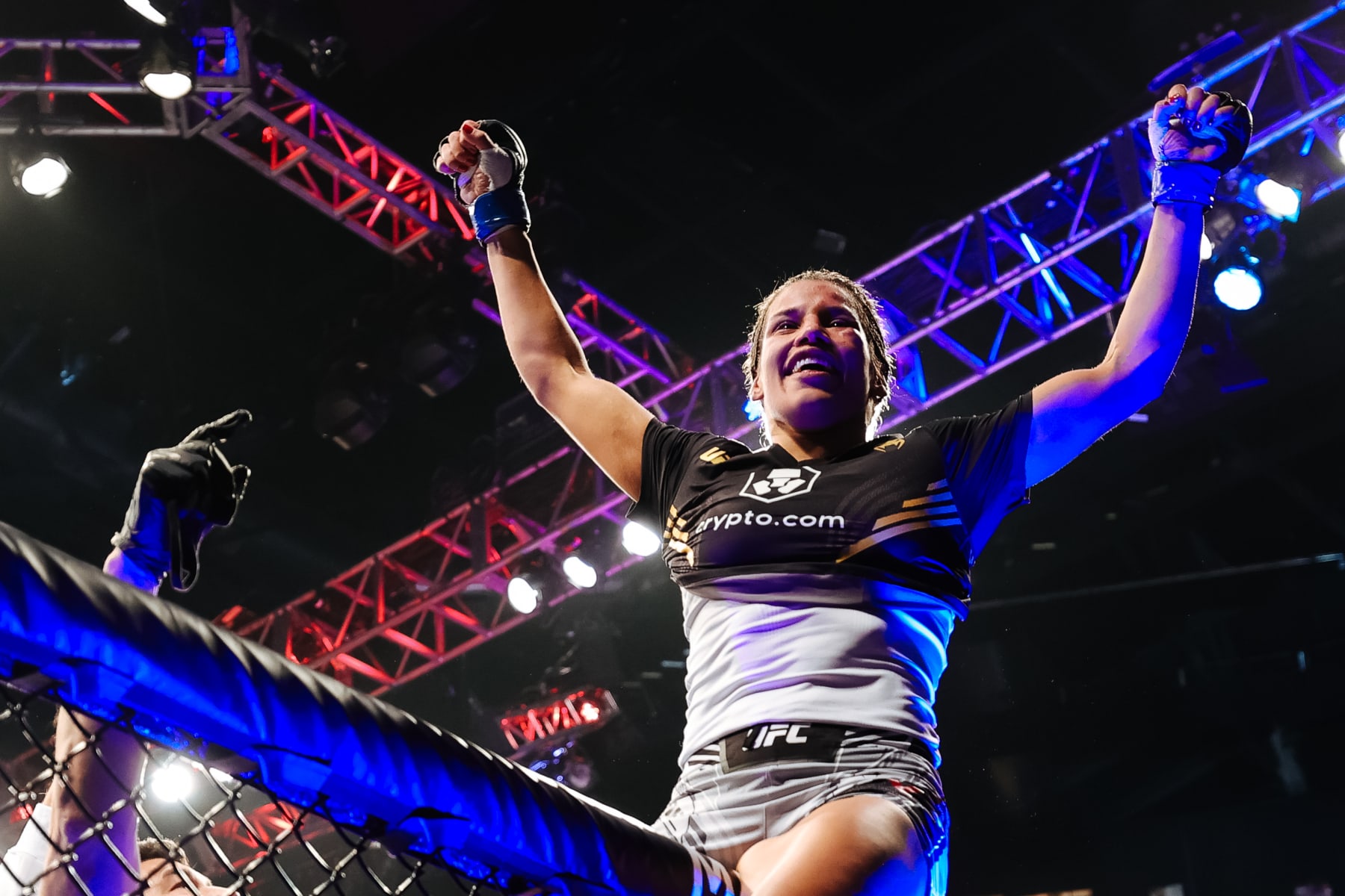 LAS VEGAS, NEVADA - DECEMBER 11: Julianna Pena celebrates after defeating Amanda Nunes of Brazil to win the women's bantamweight title during the UFC 269 event at T-Mobile Arena on December 11, 2021 in Las Vegas, Nevada. (Photo by Carmen Mandato/Getty Images)