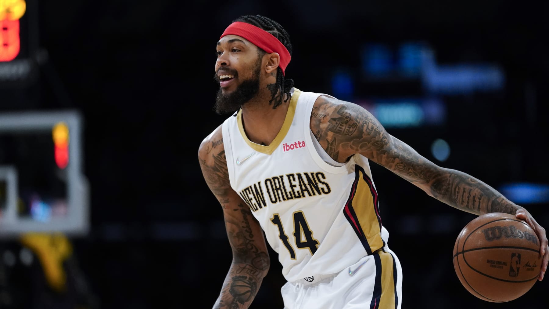 New Orleans Pelicans forward Brandon Ingram (14) controls the ball during an NBA basketball game against the Los Angeles Lakers in Los Angeles, Friday, April 1, 2022. (AP Photo/Ashley Landis)
