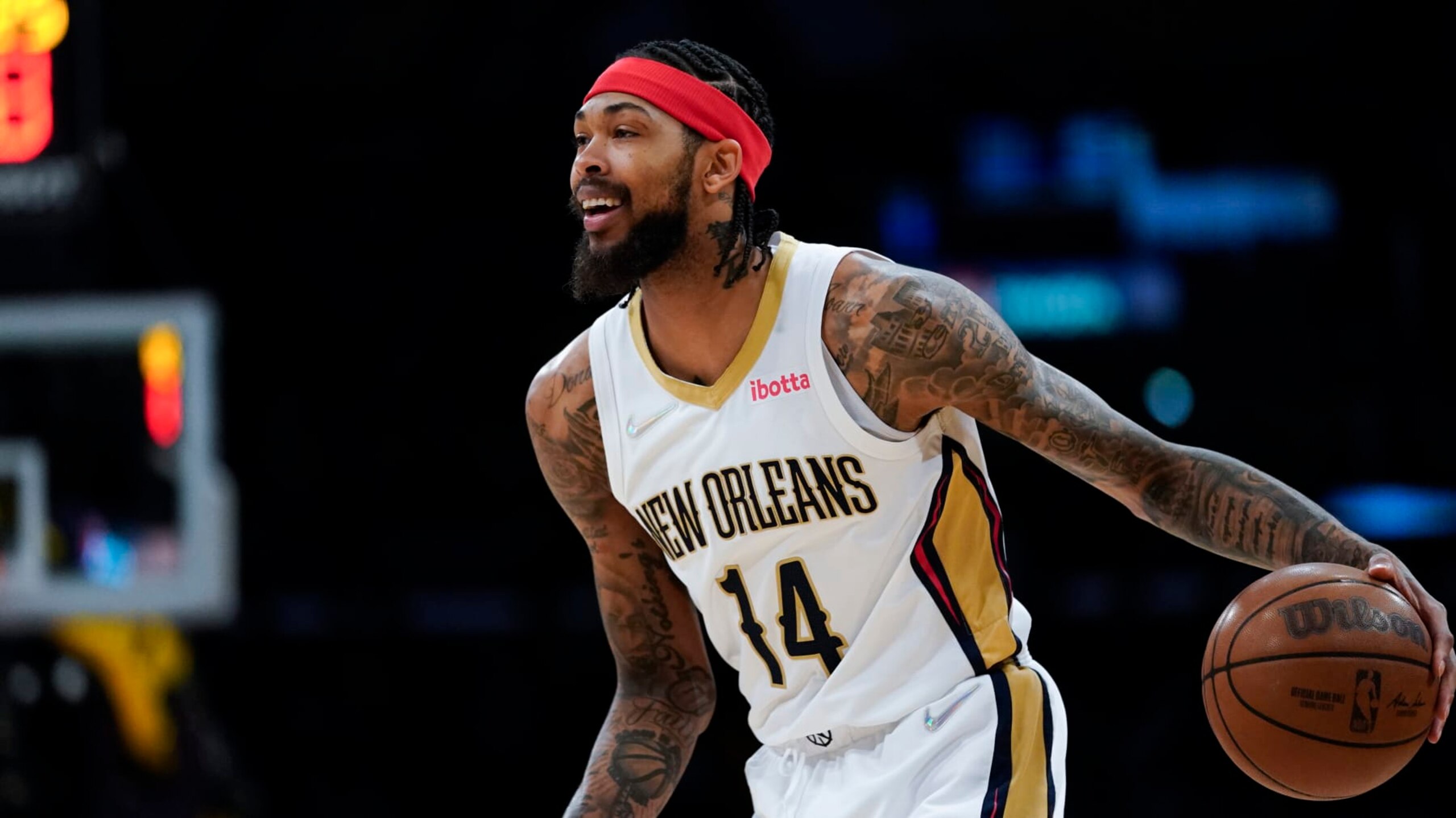 New Orleans Pelicans forward Brandon Ingram (14) controls the ball during an NBA basketball game against the Los Angeles Lakers in Los Angeles, Friday, April 1, 2022. (AP Photo/Ashley Landis)
