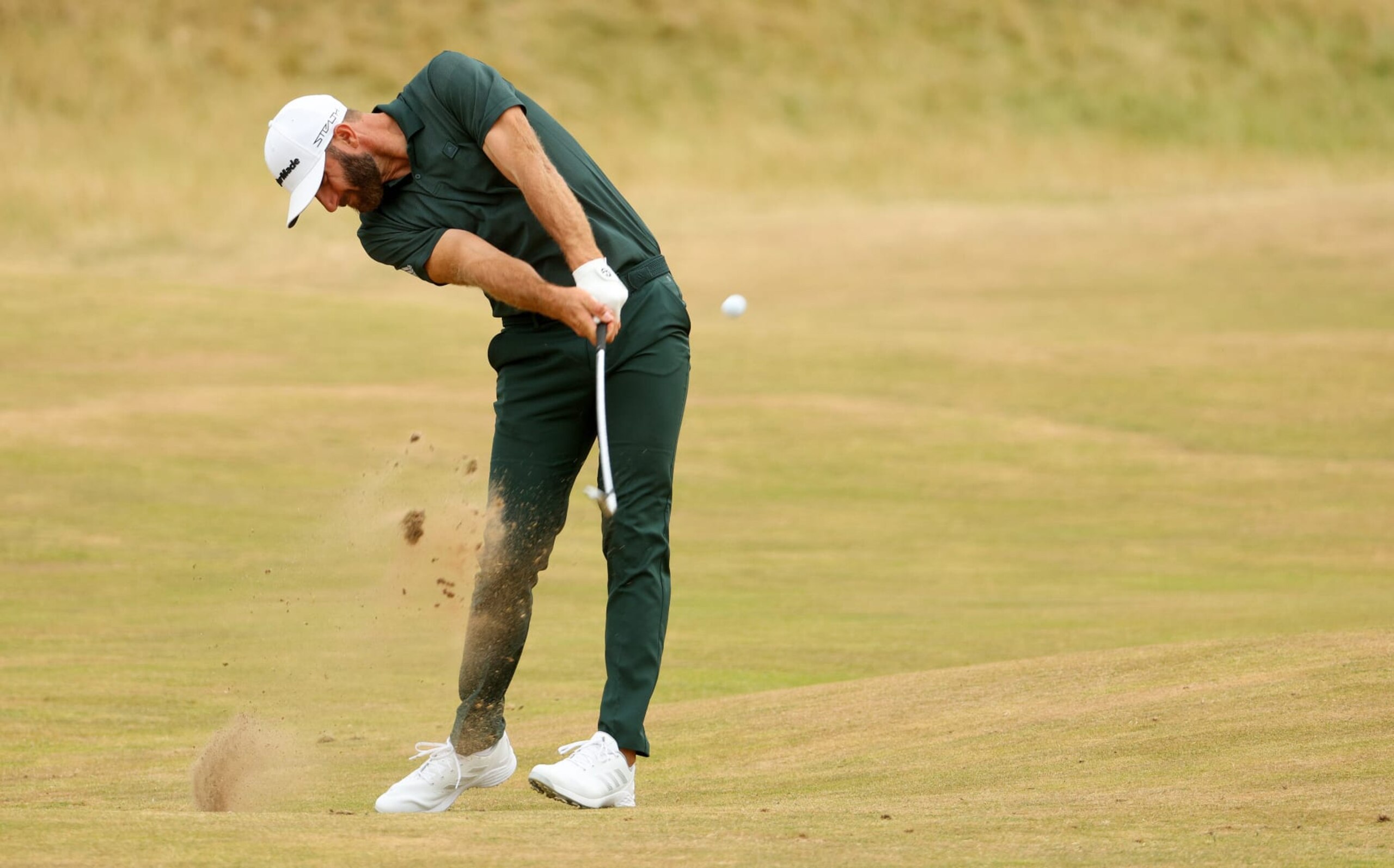 ST ANDREWS, SCOTLAND - JULY 17: Dustin Johnson of the United States plays his second shot on the 4th hole during Day Four of The 150th Open at St Andrews Old Course on July 17, 2022 in St Andrews, Scotland. (Photo by Andrew Redington/Getty Images) ST ANDREWS, SCOTLAND - JULY 17: Dustin Johnson of the United States plays his second shot on the 4th hole during Day Four of The 150th Open at St Andrews Old Course on July 17, 2022 in St Andrews, Scotland. (Photo by Andrew Redington/Getty Images)