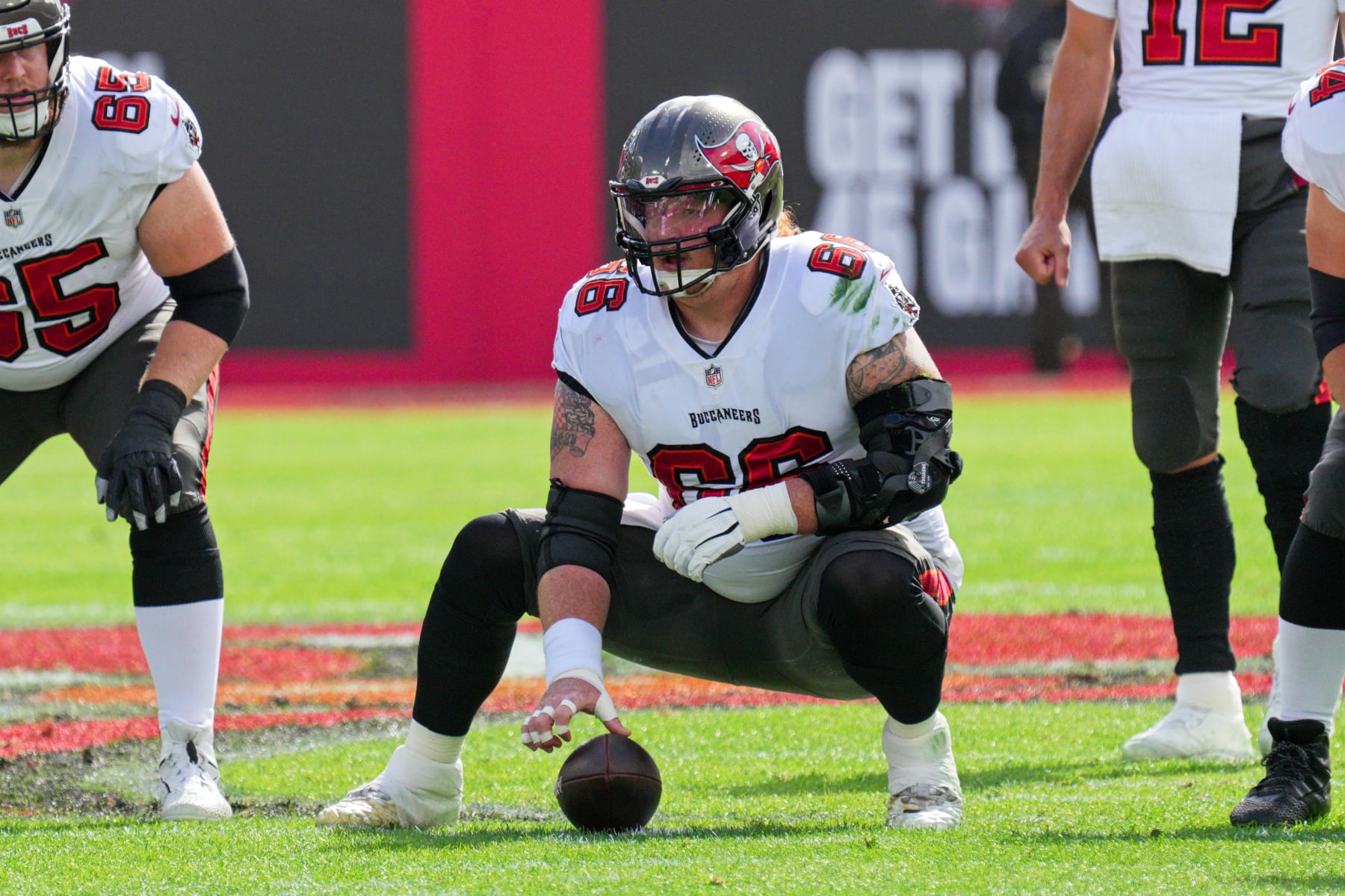 TAMPA, FL - JANUARY 16: Tampa Bay Buccaneers center Ryan Jensen (66) waits to snap the ball during the game between the Philadelphia Eagles and the Tampa Bay Buccaneers on January 16, 2022 at  Raymond James Stadium in Tampa, FL. (Photo by Andy Lewis/Icon Sportswire via Getty Images)