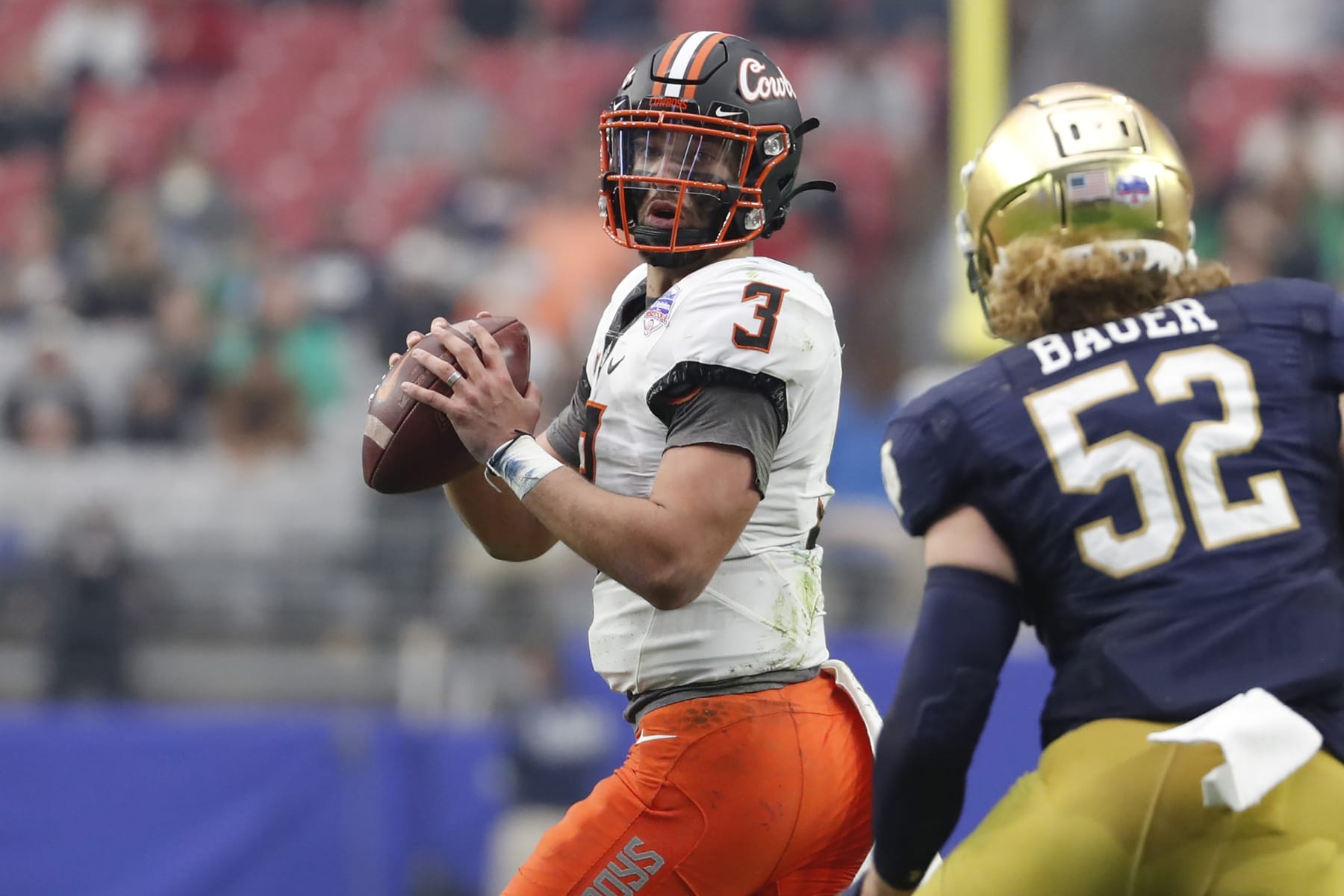 GLENDALE, ARIZONA - JANUARY 01: Quarterback Spencer Sanders #3 of the Oklahoma State Cowboys passes during the second half of the PlayStation Fiesta Bowl against the Notre Dame Fighting Irish at State Farm Stadium on January 01, 2022 in Glendale, Arizona. The Cowboys defeated the Fighting Irish 37-35. (Photo by Chris Coduto/Getty Images) GLENDALE, ARIZONA - JANUARY 01: Quarterback Spencer Sanders #3 of the Oklahoma State Cowboys passes during the second half of the PlayStation Fiesta Bowl against the Notre Dame Fighting Irish at State Farm Stadium on January 01, 2022 in Glendale, Arizona. The Cowboys defeated the Fighting Irish 37-35. (Photo by Chris Coduto/Getty Images)