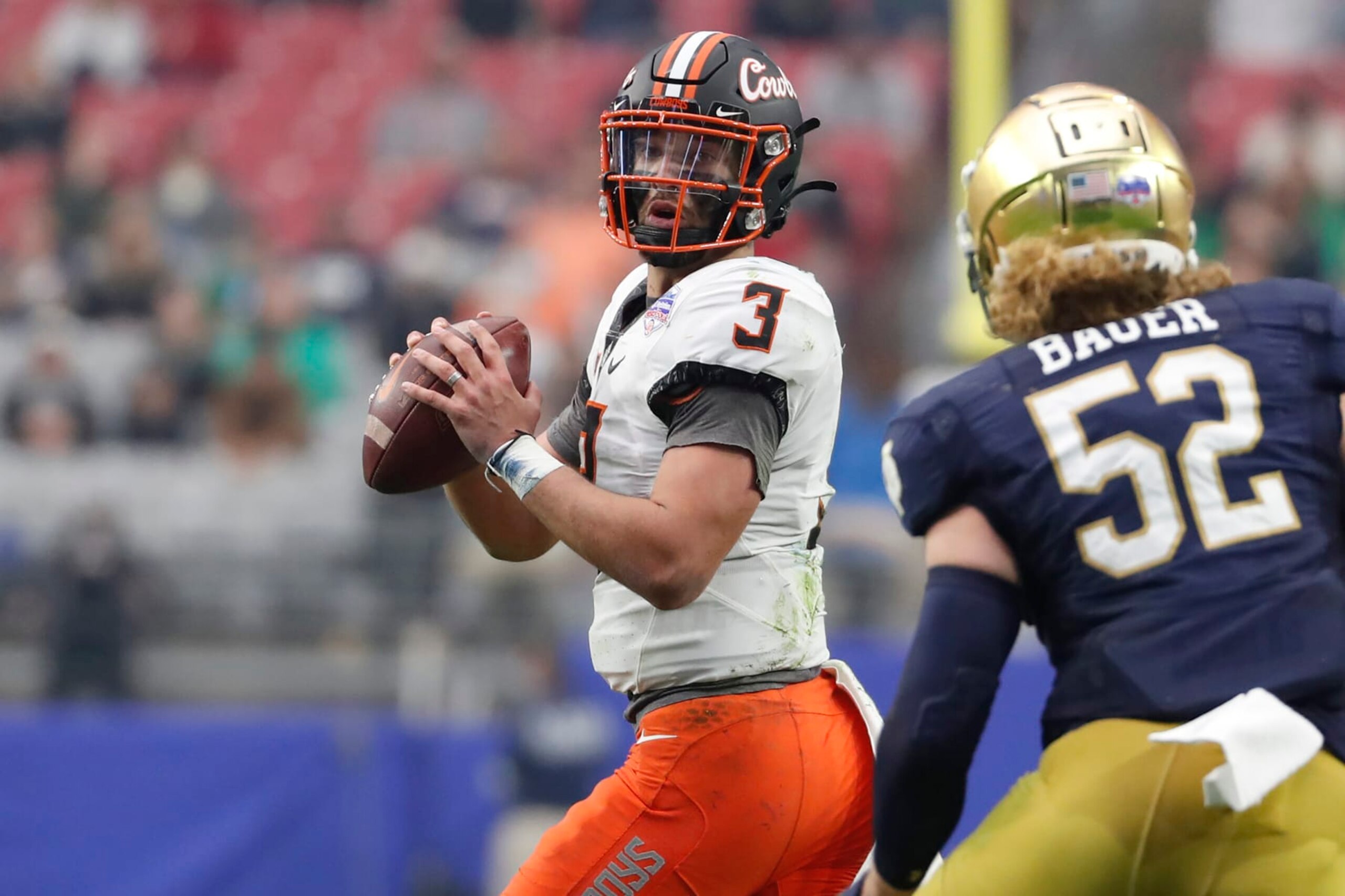 GLENDALE, ARIZONA - JANUARY 01: Quarterback Spencer Sanders #3 of the Oklahoma State Cowboys passes during the second half of the PlayStation Fiesta Bowl against the Notre Dame Fighting Irish at State Farm Stadium on January 01, 2022 in Glendale, Arizona. The Cowboys defeated the Fighting Irish 37-35.  (Photo by Chris Coduto/Getty Images)