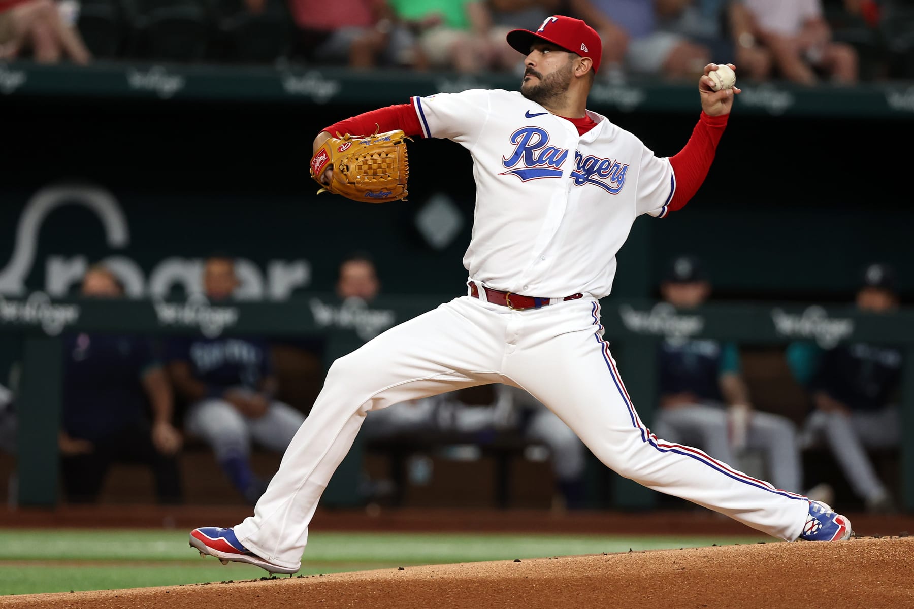 ARLINGTON, TEXAS - JULY 14: Martin Perez #54 of the Texas Rangers pitches against the Seattle Mariners at Globe Life Field on July 14, 2022 in Arlington, Texas. (Photo by Richard Rodriguez/Getty Images)