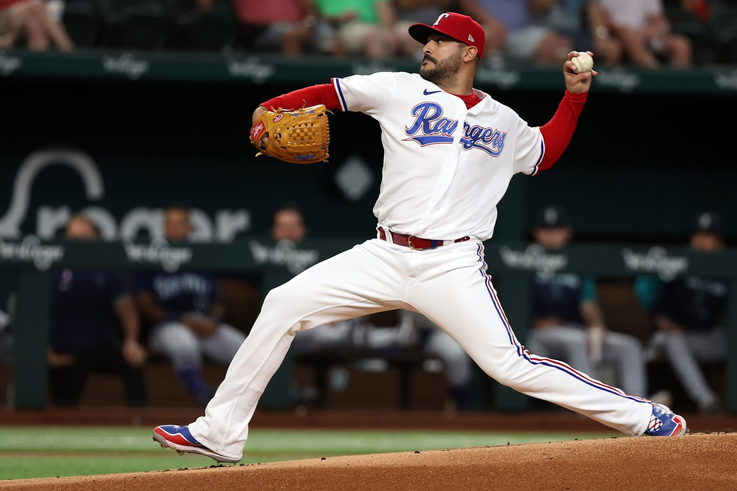 ARLINGTON, TEXAS - JULY 14: Martin Perez #54 of the Texas Rangers pitches against the Seattle Mariners at Globe Life Field on July 14, 2022 in Arlington, Texas. (Photo by Richard Rodriguez/Getty Images)