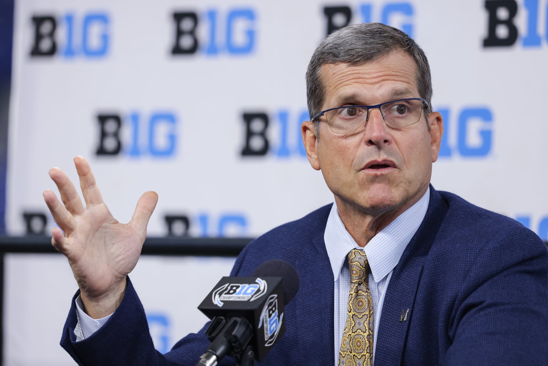 INDIANAPOLIS, IN - JULY 26: Head coach Jim Harbaugh of the Michigan Wolverines speaks during the 2022 Big Ten Conference Football Media Days at Lucas Oil Stadium on July 26, 2022 in Indianapolis, Indiana. (Photo by Michael Hickey/Getty Images) INDIANAPOLIS, IN - JULY 26: Head coach Jim Harbaugh of the Michigan Wolverines speaks during the 2022 Big Ten Conference Football Media Days at Lucas Oil Stadium on July 26, 2022 in Indianapolis, Indiana. (Photo by Michael Hickey/Getty Images)