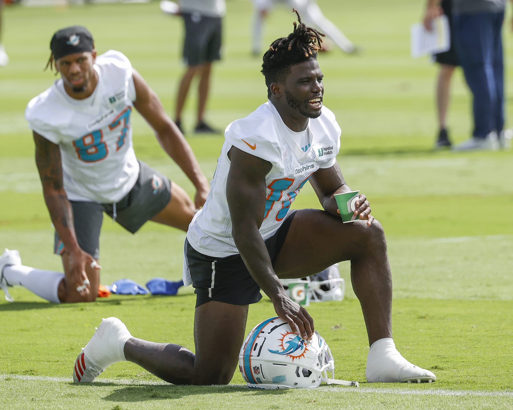 MIAMI GARDENS, FL - JUNE 2: Tyreek Hill #10 of the Miami Dolphins stretches during the Miami Dolphins Mandatory Minicamp at the Baptist Health Training Complex on June 2, 2022 in Miami Gardens, Florida. (Photo by Joel Auerbach/Getty Images)