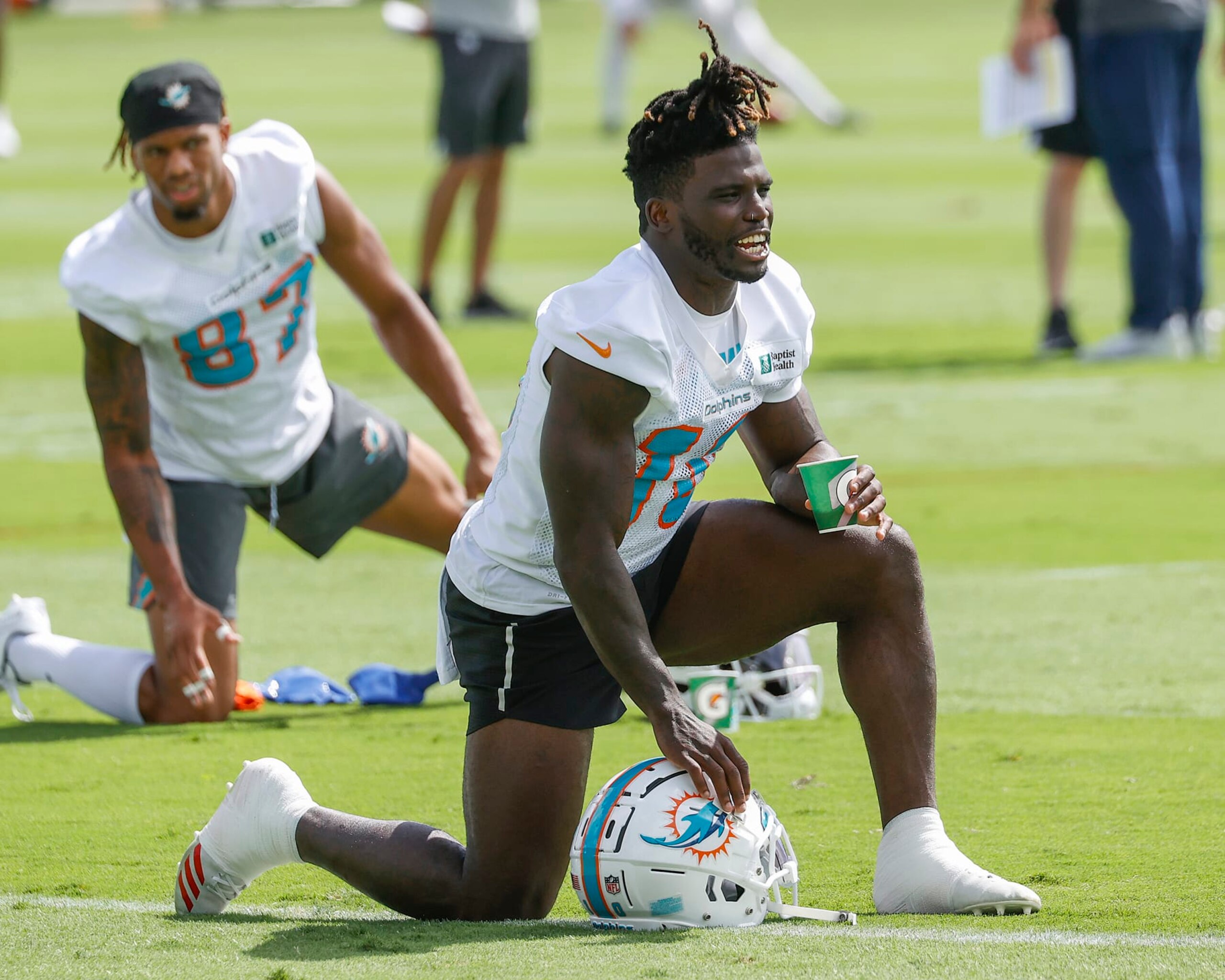 MIAMI GARDENS, FL - JUNE 2: Tyreek Hill #10 of the Miami Dolphins stretches during the Miami Dolphins Mandatory Minicamp at the Baptist Health Training Complex on June 2, 2022 in Miami Gardens, Florida. (Photo by Joel Auerbach/Getty Images)